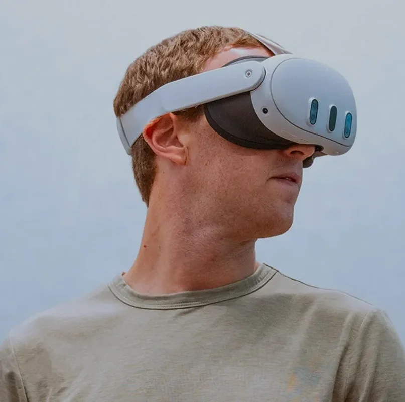 Mark Zuckerberg wearing Meta Quest 3 VR headset virtual reality gaming device for immersive mixed reality experience