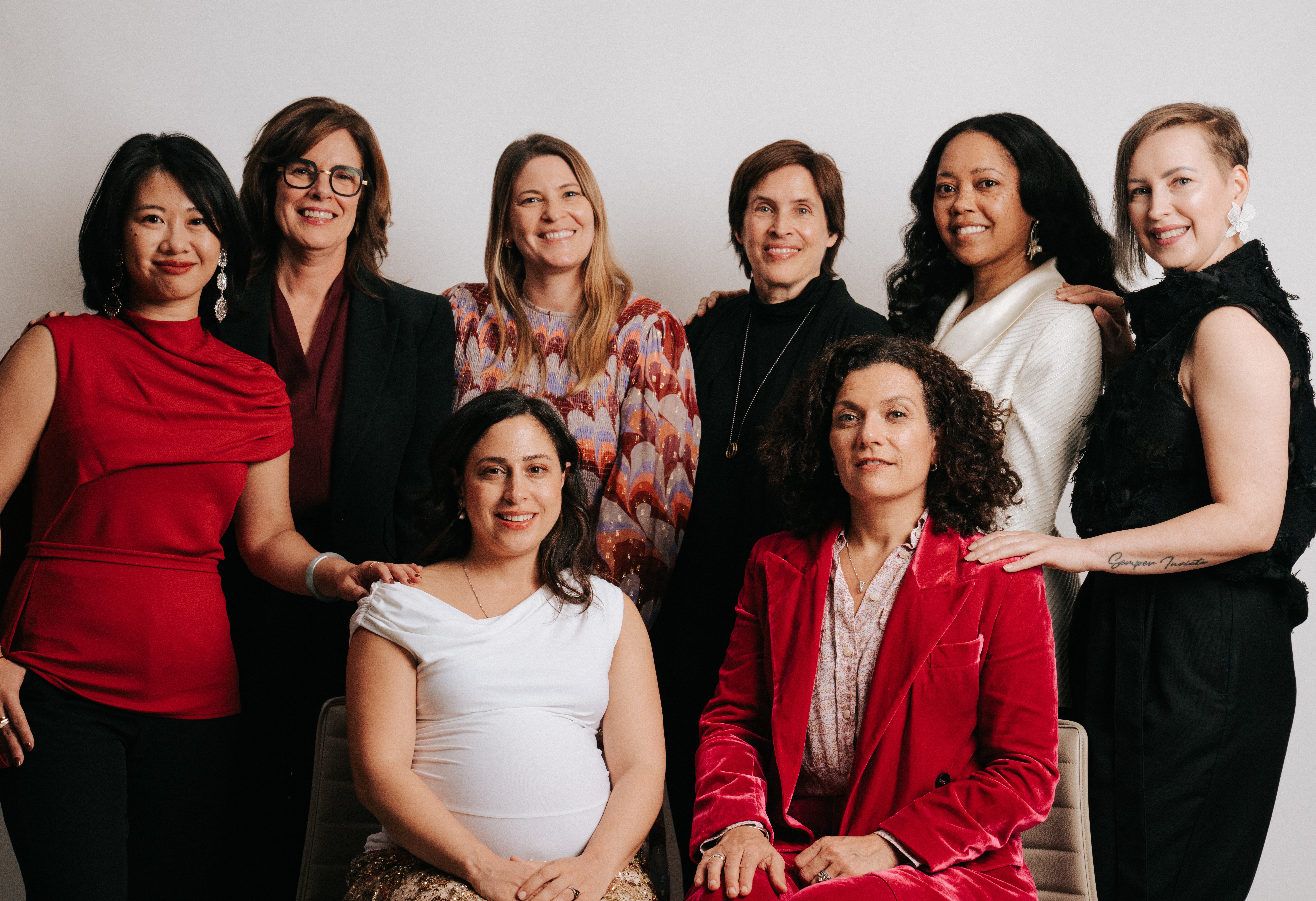 Speaker on stage with the words "Welcome Innovators" on a slide behind her
