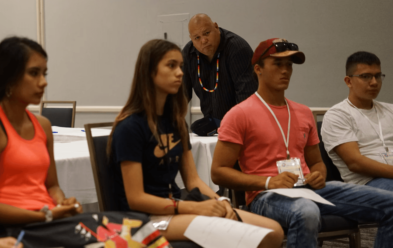 a black and white living room with a large tv