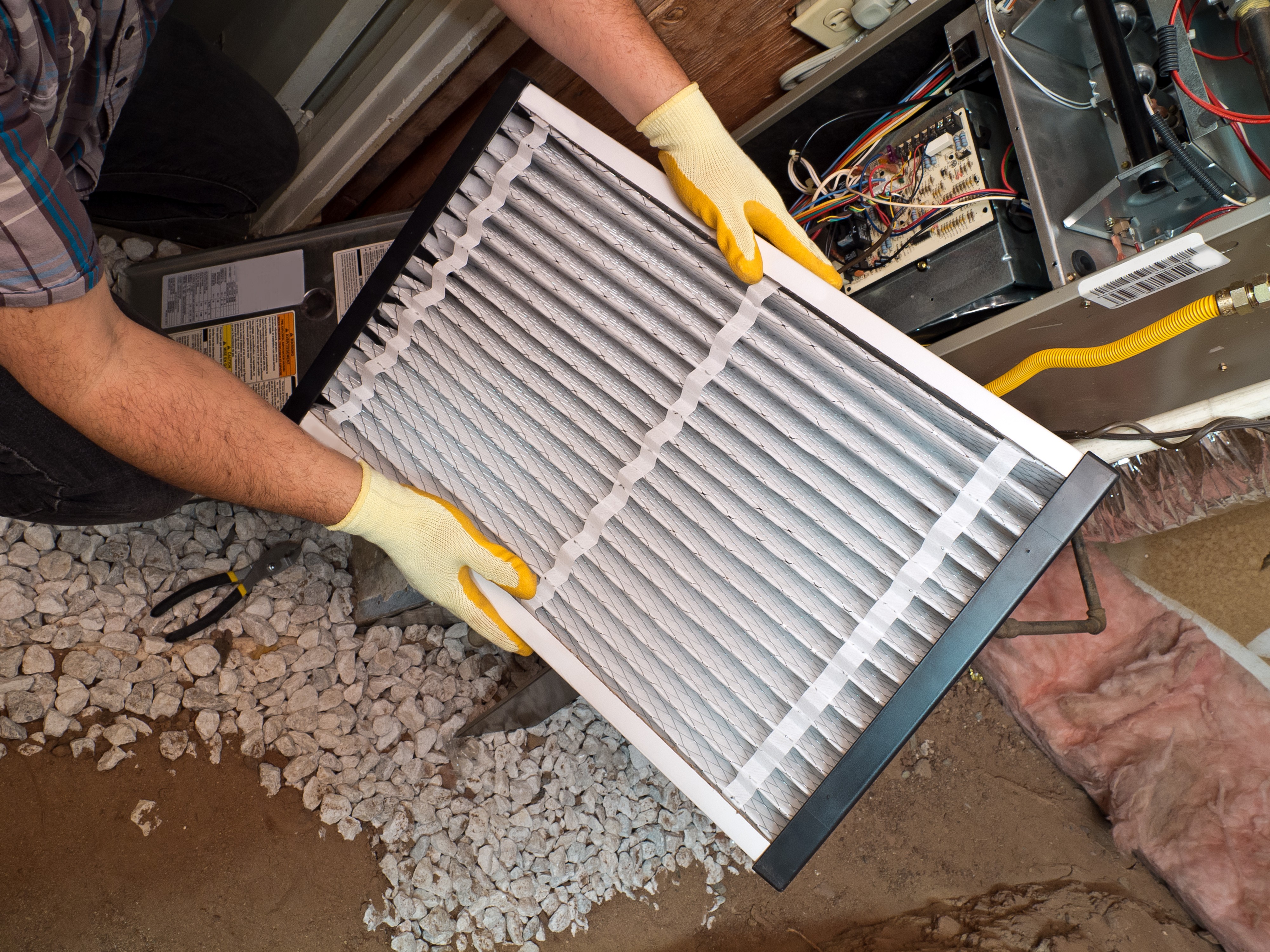 man holding air filter