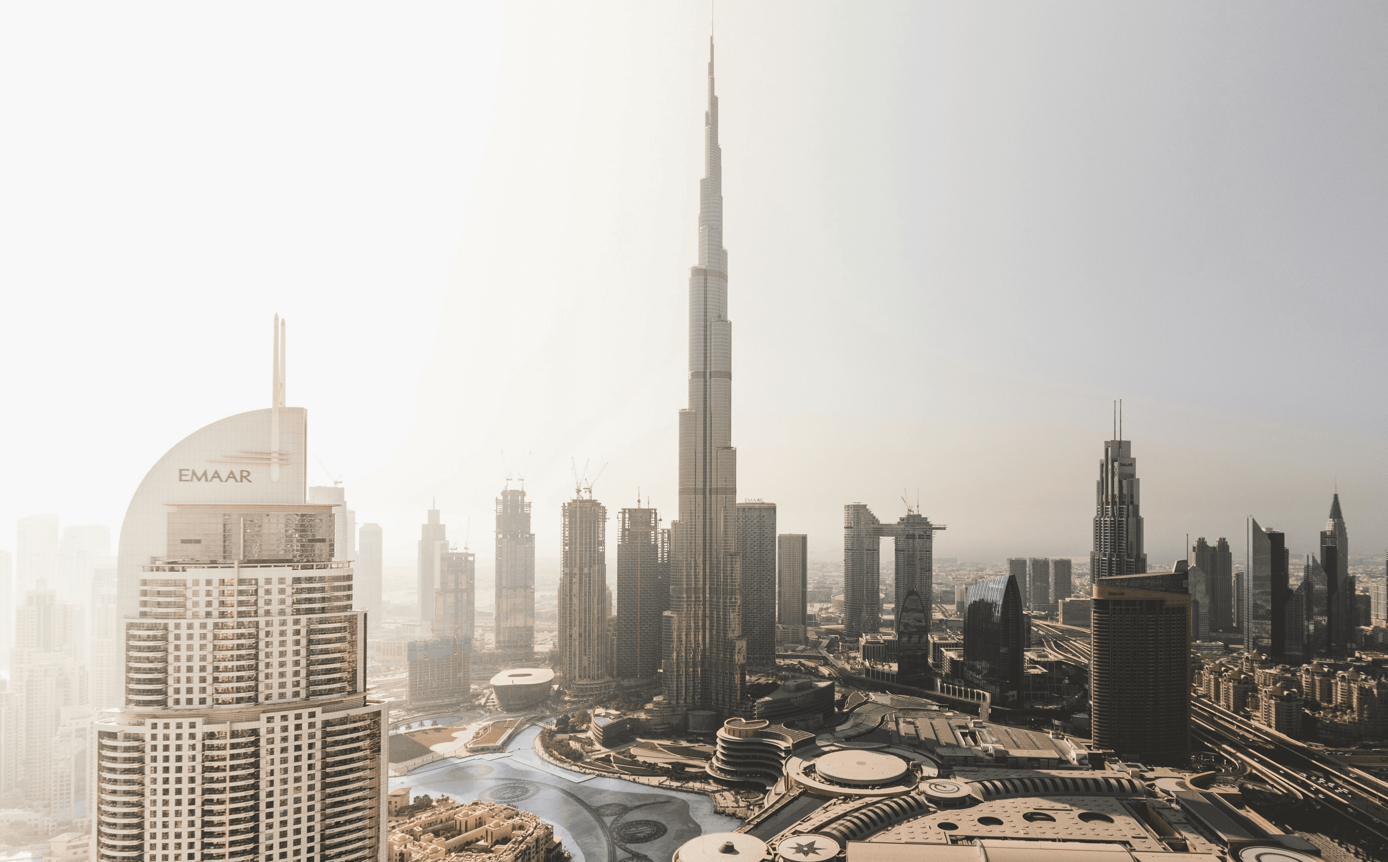 high rise buildings near body of water during daytime