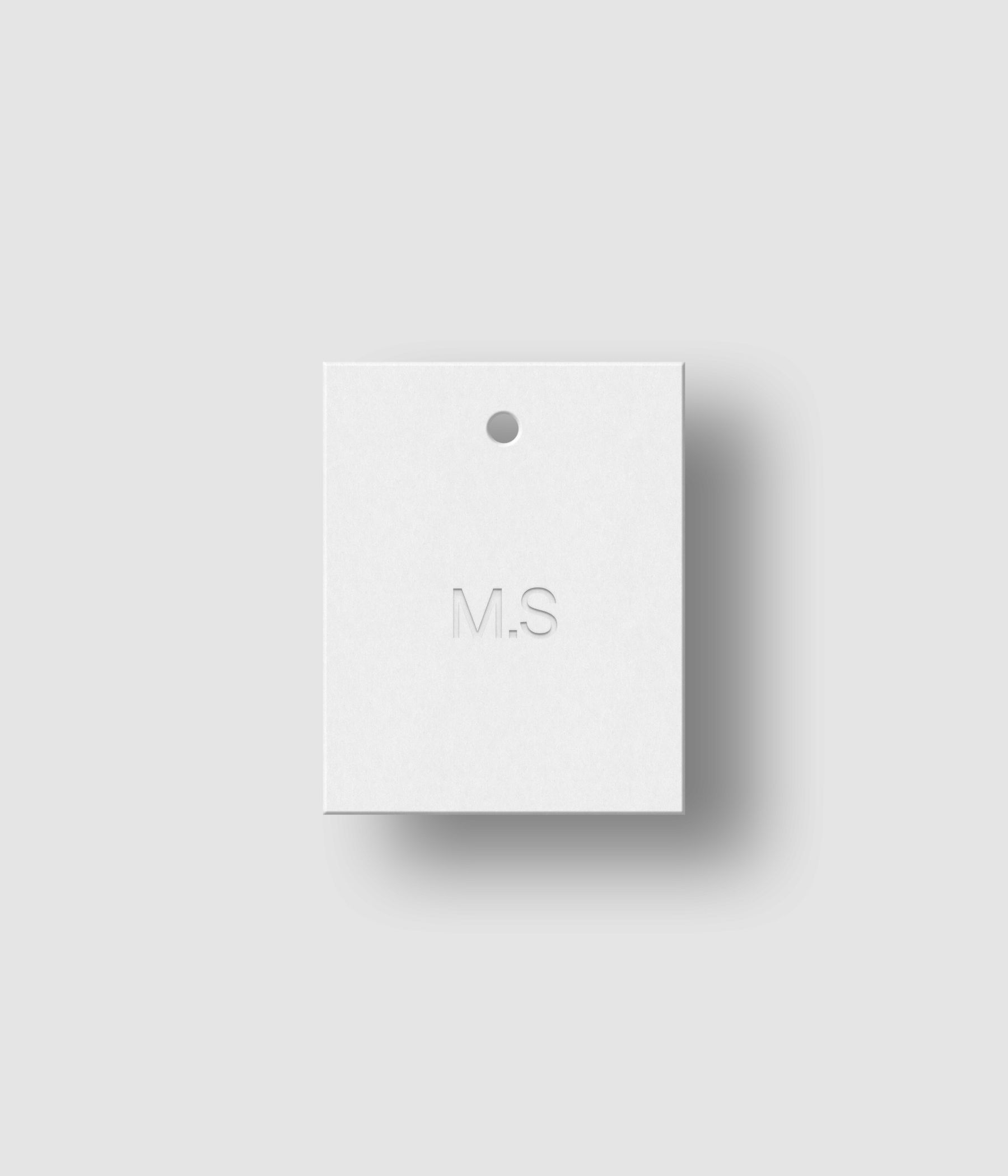 White 4x5 hang tag mockup on white background with soft shadow and debossed logo effect for Photoshop download psd