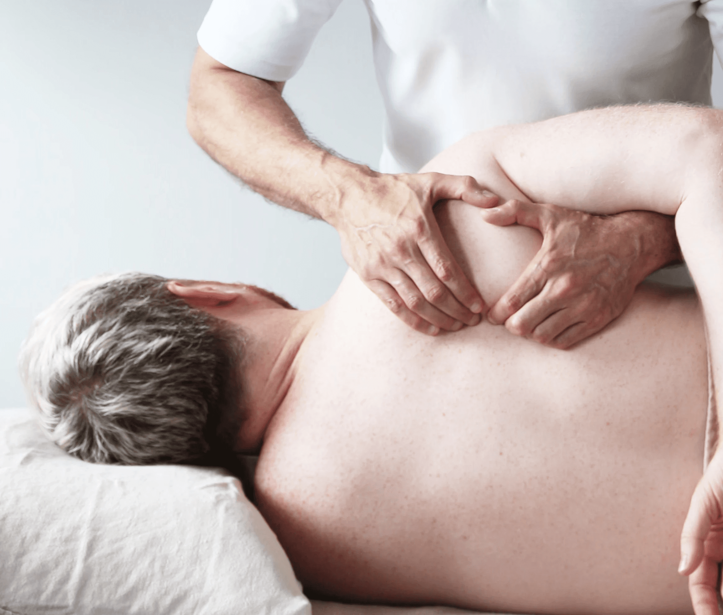 Close-up of a woman holding a dropper with skincare serum, preparing to apply it to her hand
