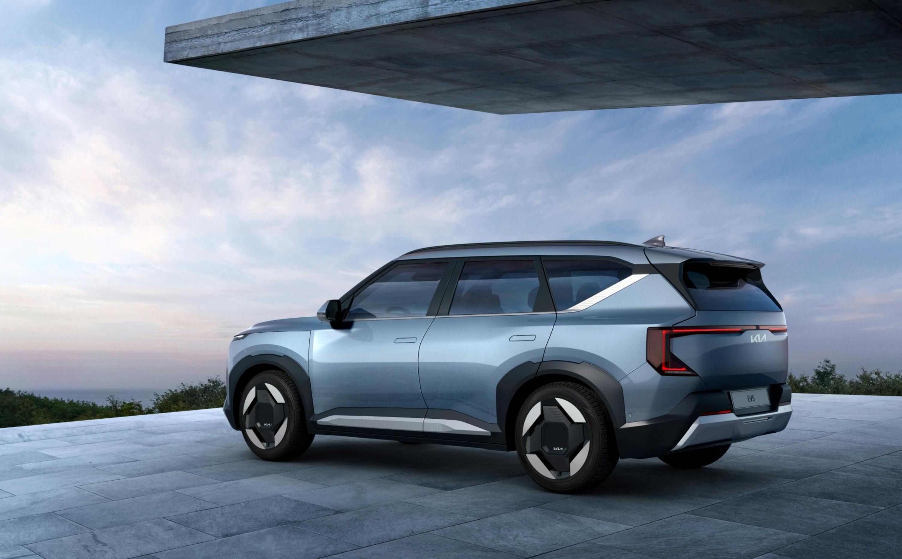 Side view of electric crossover SUV on elevated terrace, futuristic vehicle styling