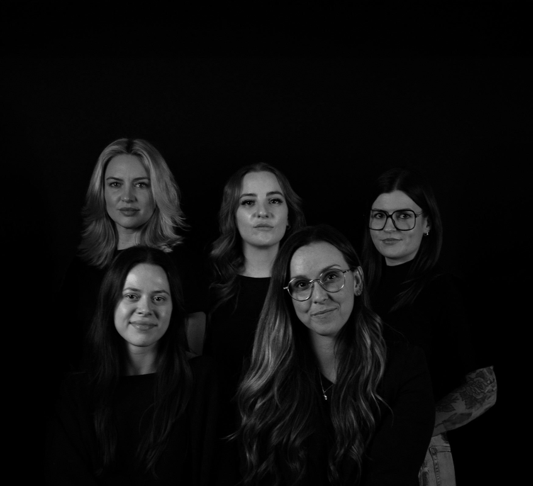 People celebrating, red stickers floating in the air