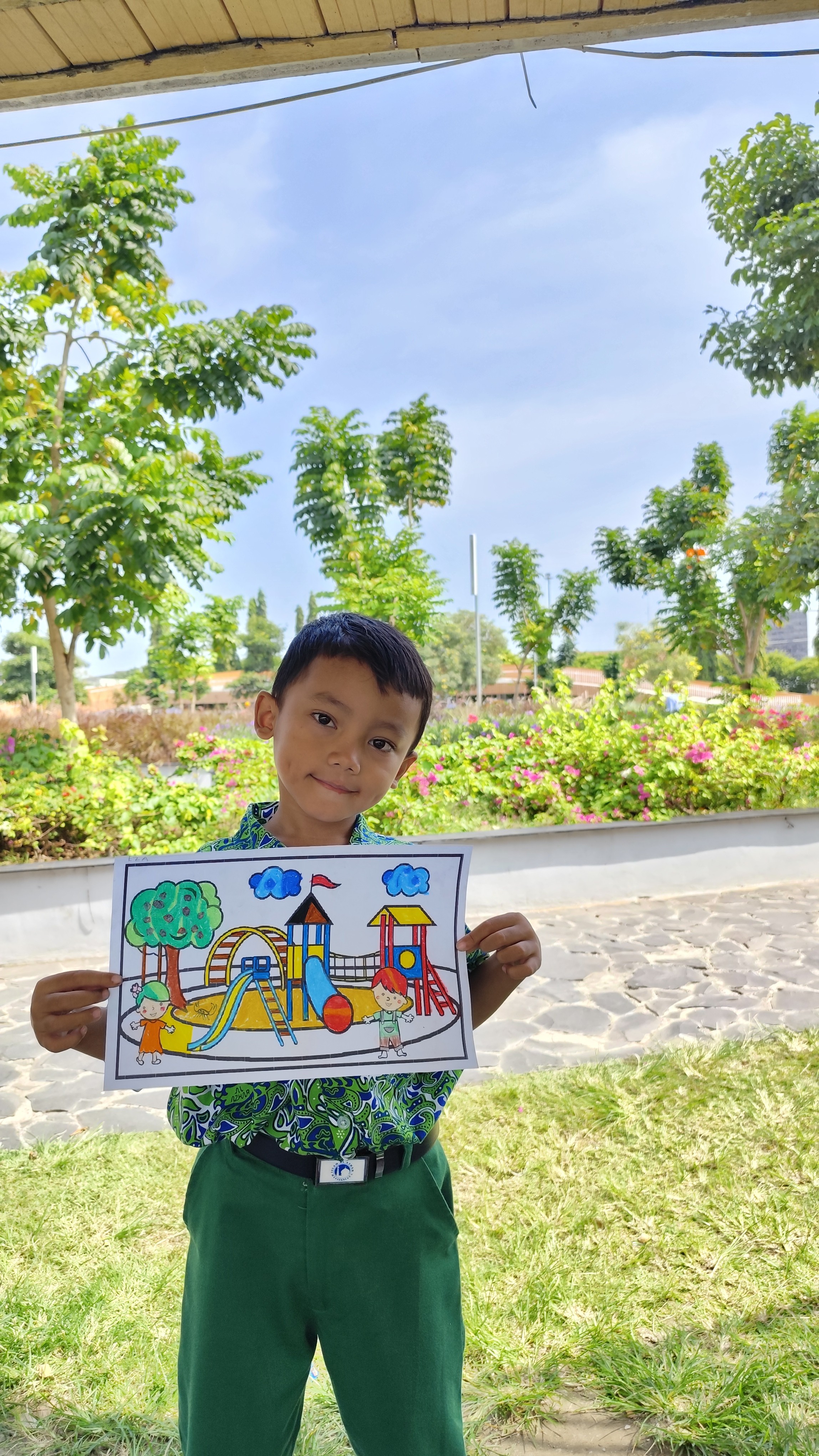 green and white floral book beside white pen and white and black pen