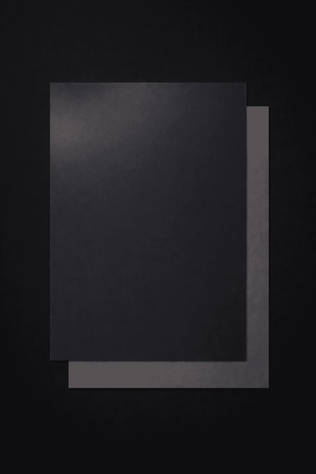 woman holding a phone and man looking at the phone. both are smiling