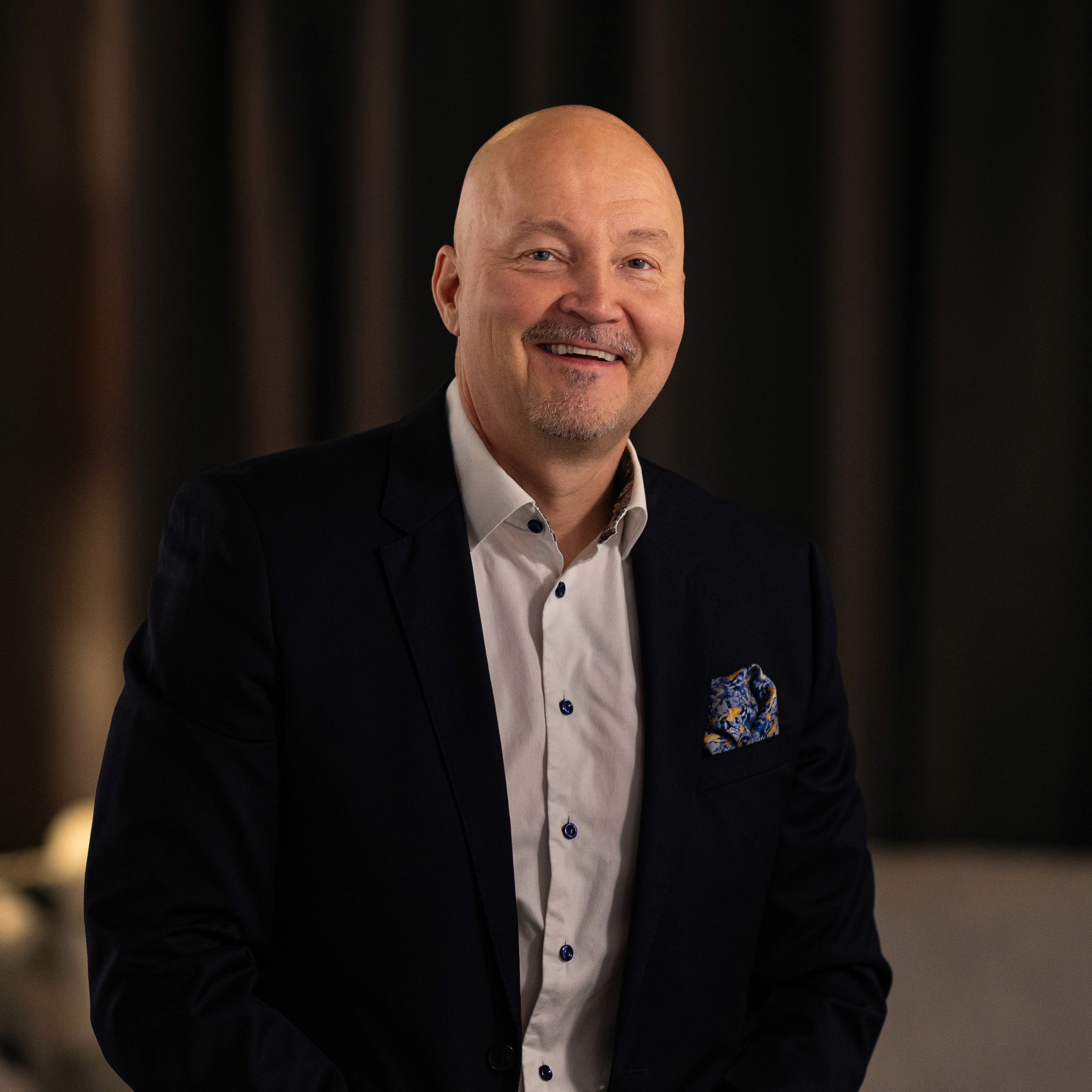Portrait of John Doe Anderson, CEO of Omnis.