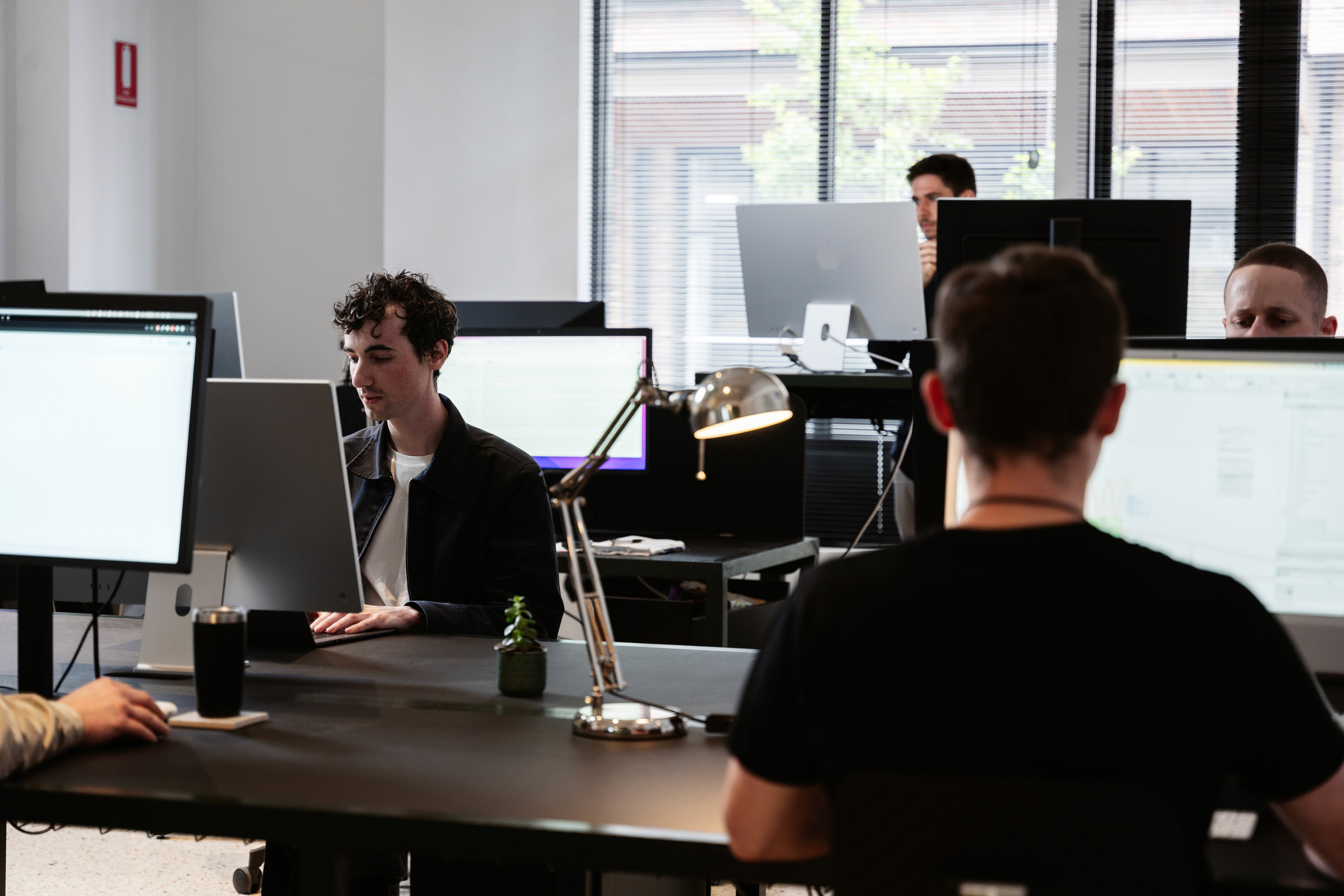 two teal-and-white skyscrapers