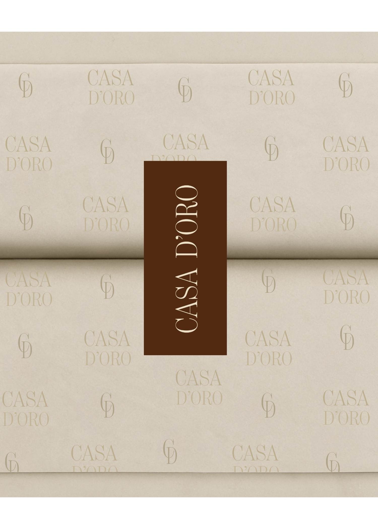 Casa D’Oro custom branded wrapping paper with monogram pattern and earthy brown brand sticker.