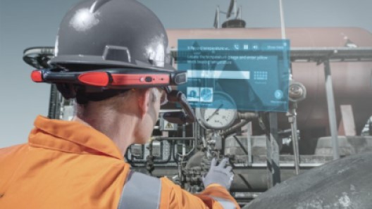 An industrialworker wearing an intrinsically safe RealWear headset and receiving augmented reality guidance to do his job