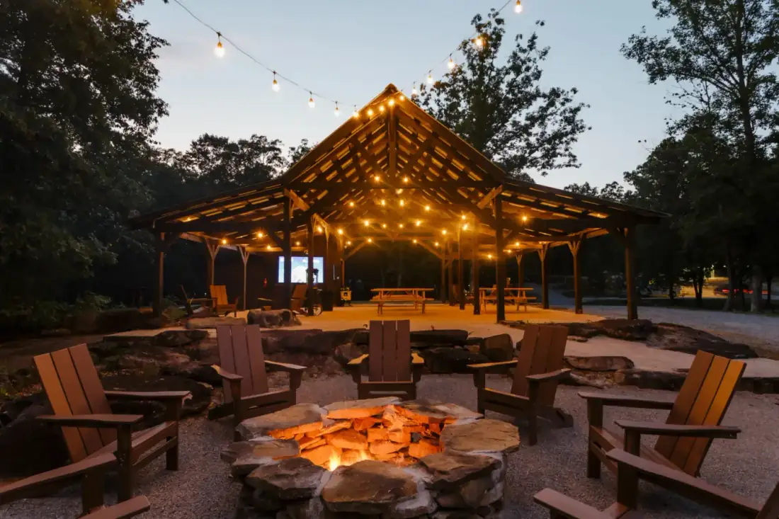 Adirodack chairs in a circle under string lights