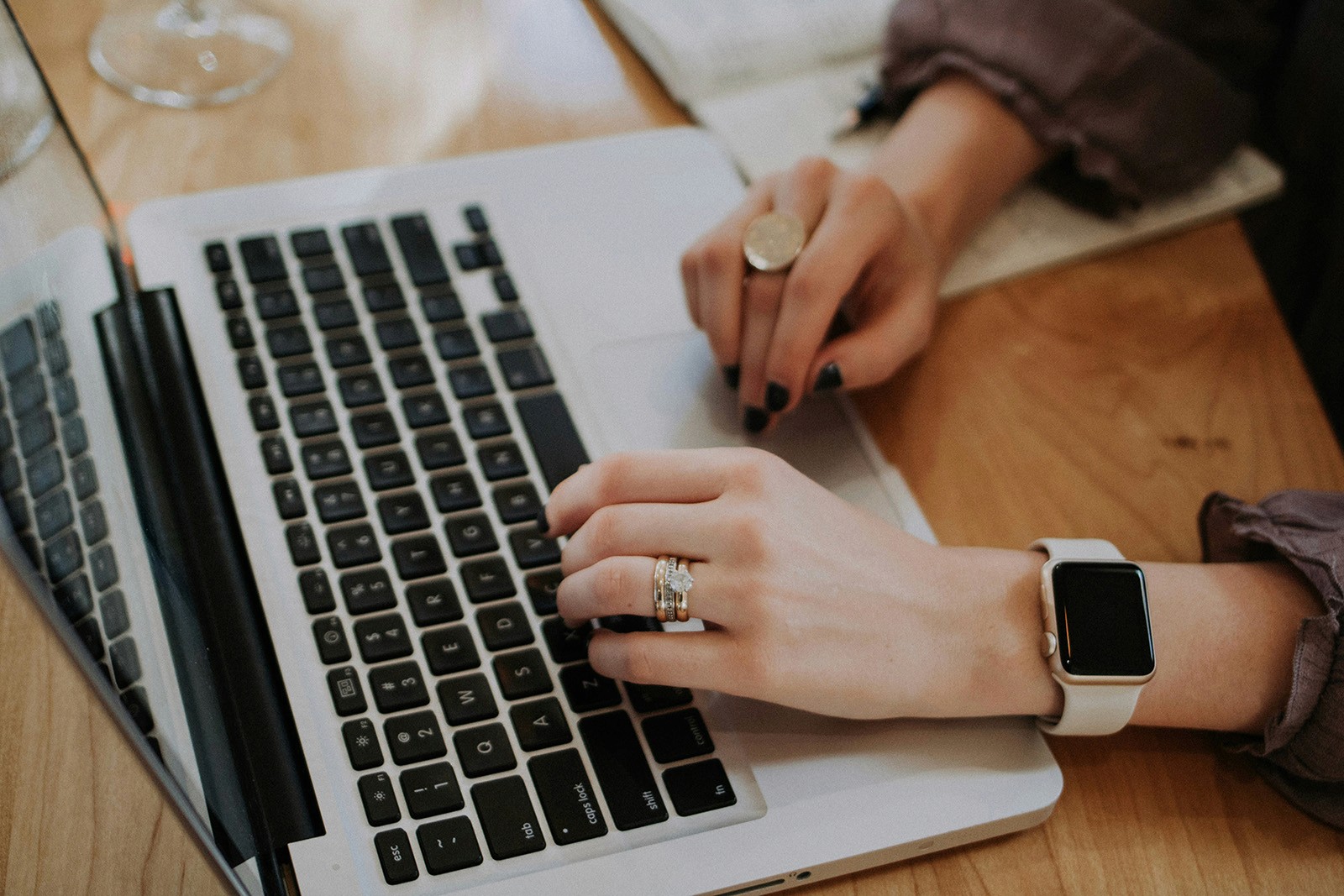 Close up of a woman working on a laptop