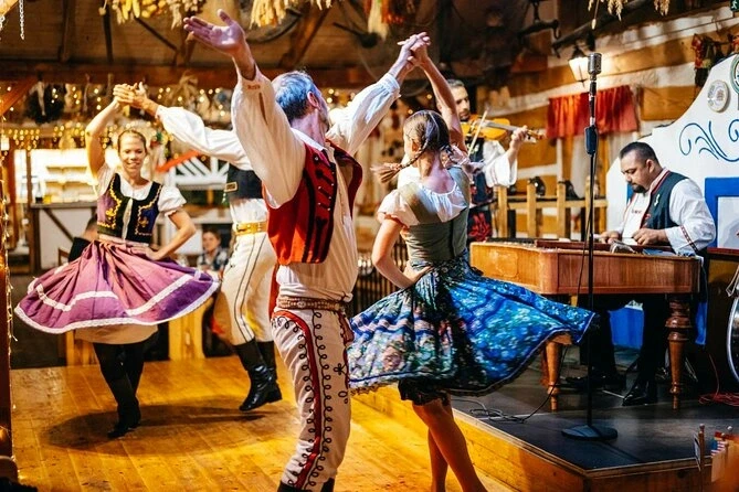 Traditional folk dancers performing indoors