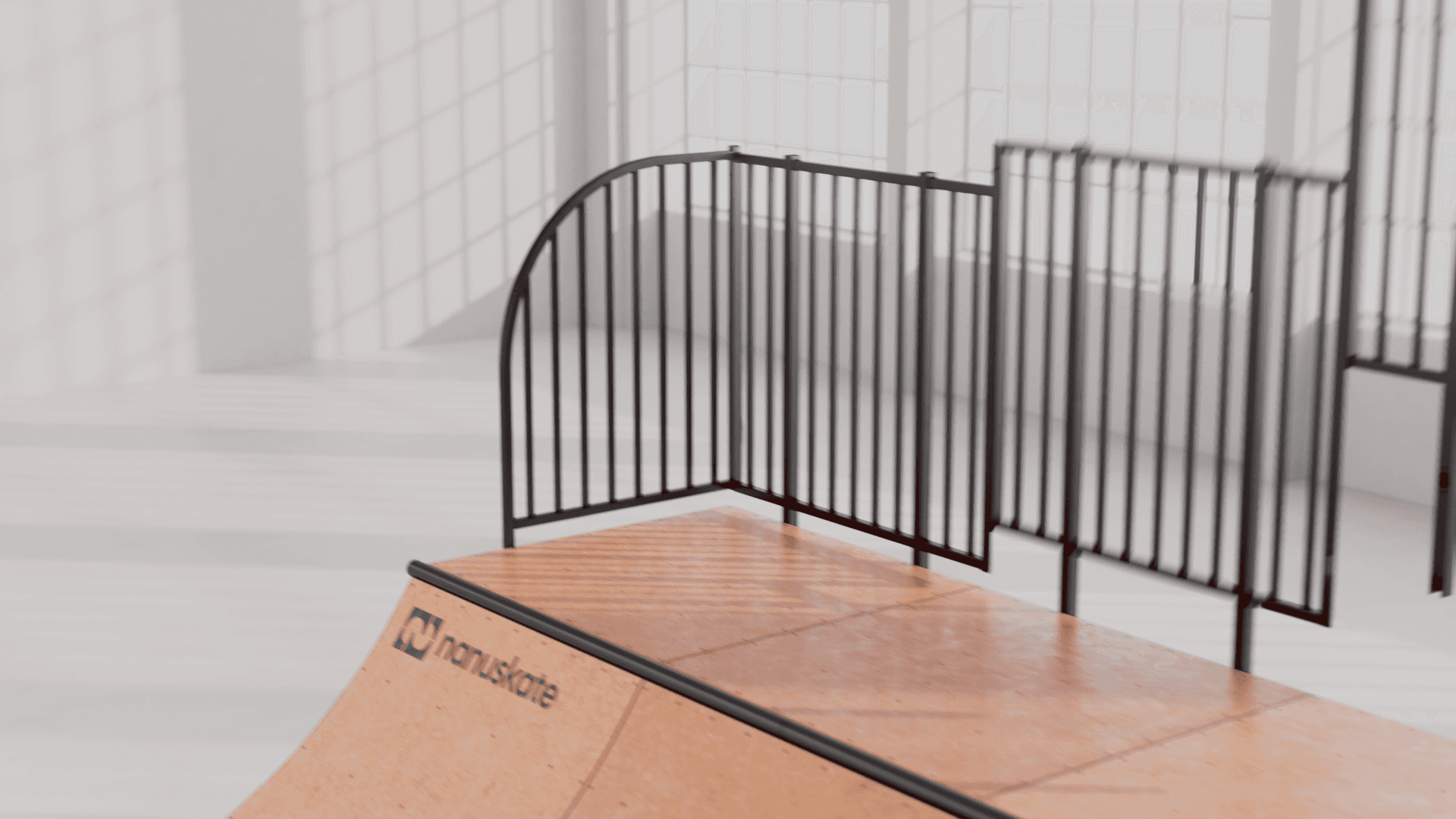 nanuskate skateboard ramp with black railings in a bright indoor skatepark, ideal for tricks and stunts.