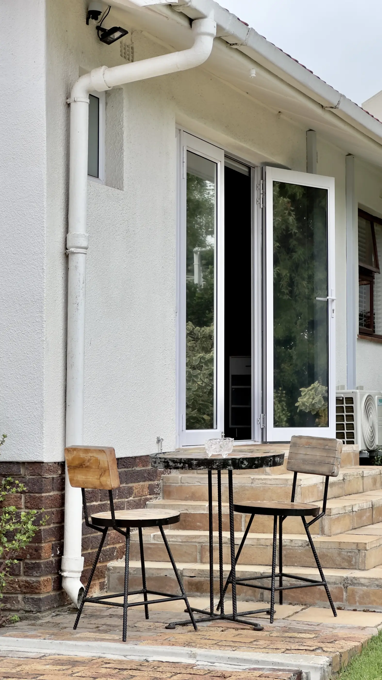 Outside table and chairs at the entrace of our A View Twenty-Four 7 room.