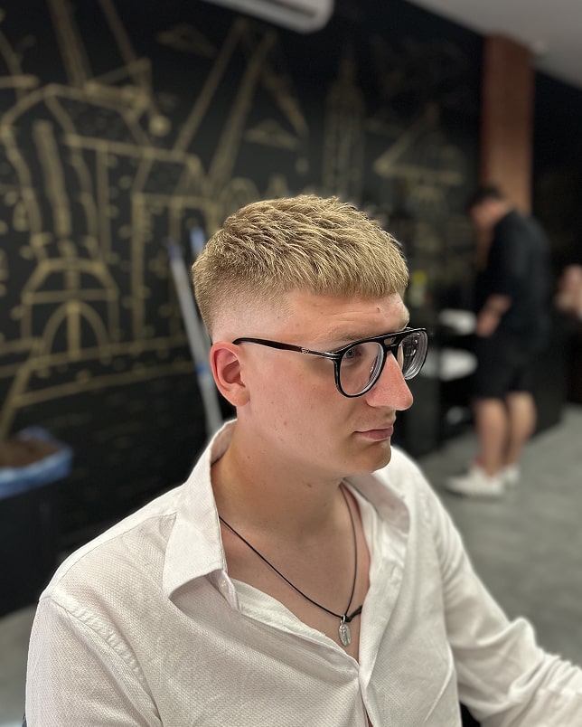 Close up of a drink being poured between friends