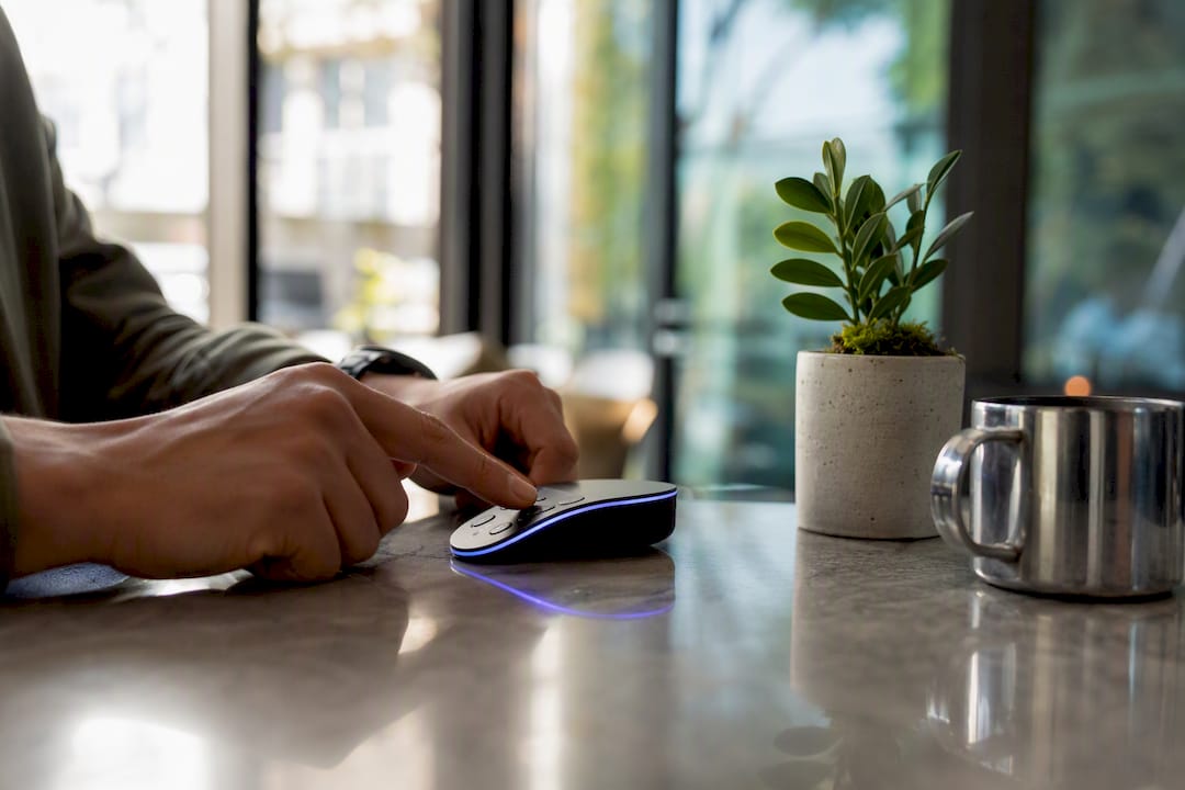 Hands configuring AI messaging device