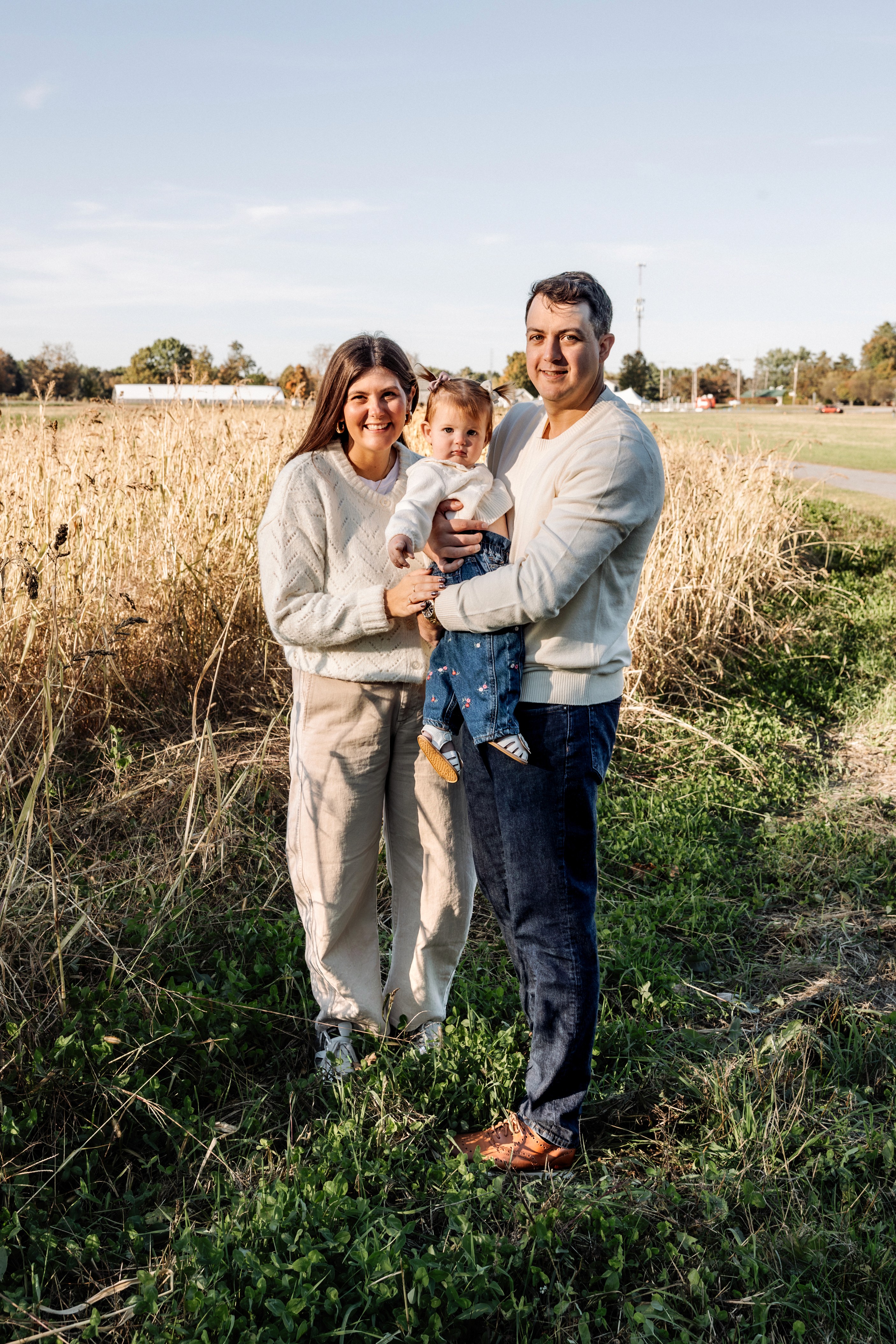 Family basking in the warm glow of golden hour at Pitney Meadow Farm in Saratoga Springs, NY — luminous, candid golden hour family photography by Lizz Spano Photography, Saratoga Springs family photographer.