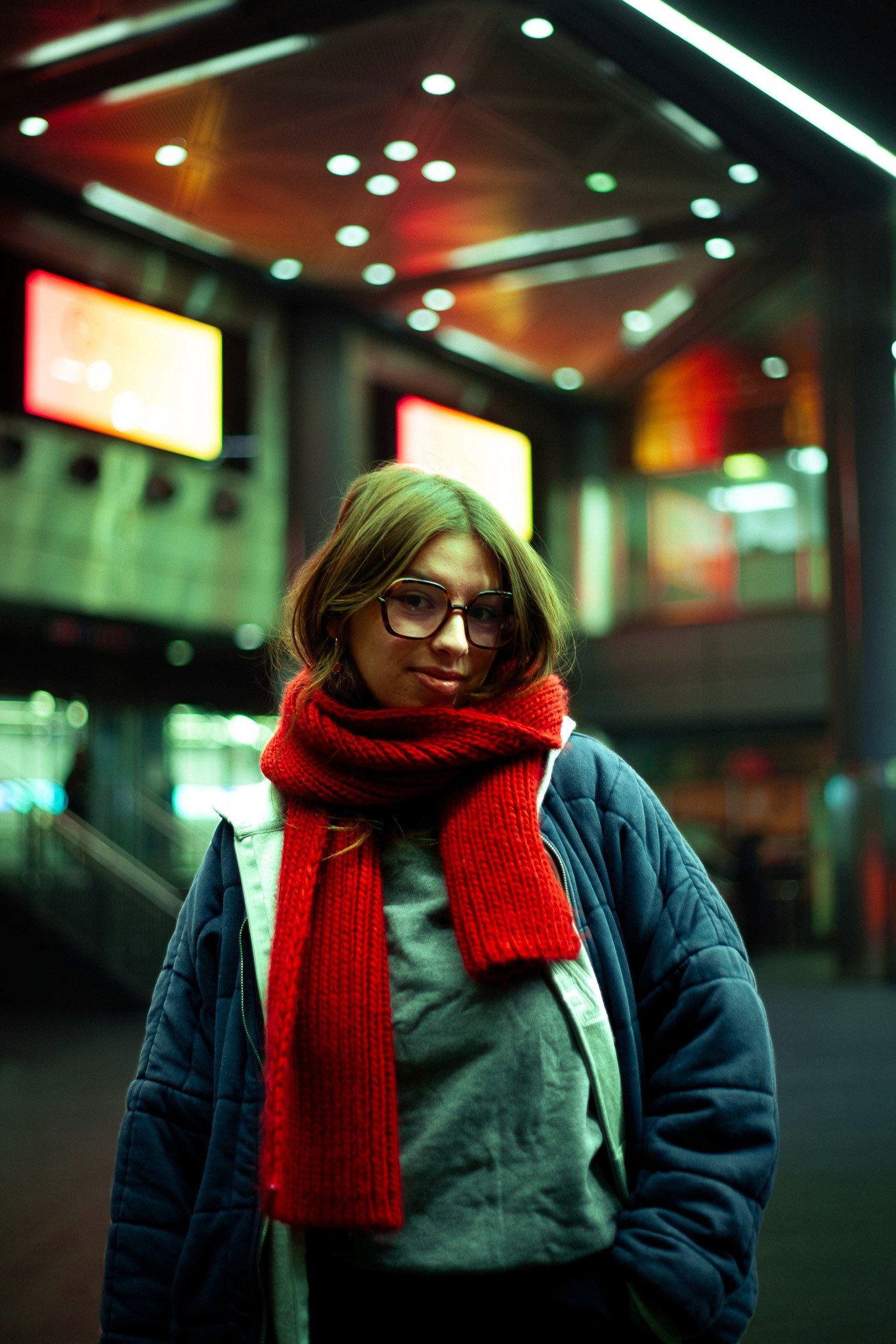 a woman with a red scraf