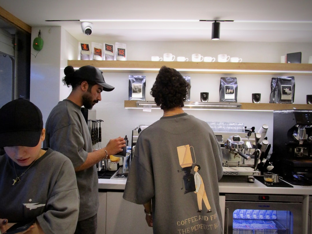 Barista preparing coffee behind a counter