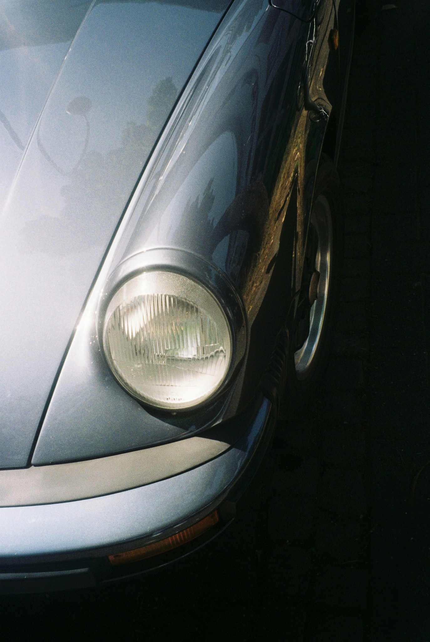 Close-up of a classic silver car headlight