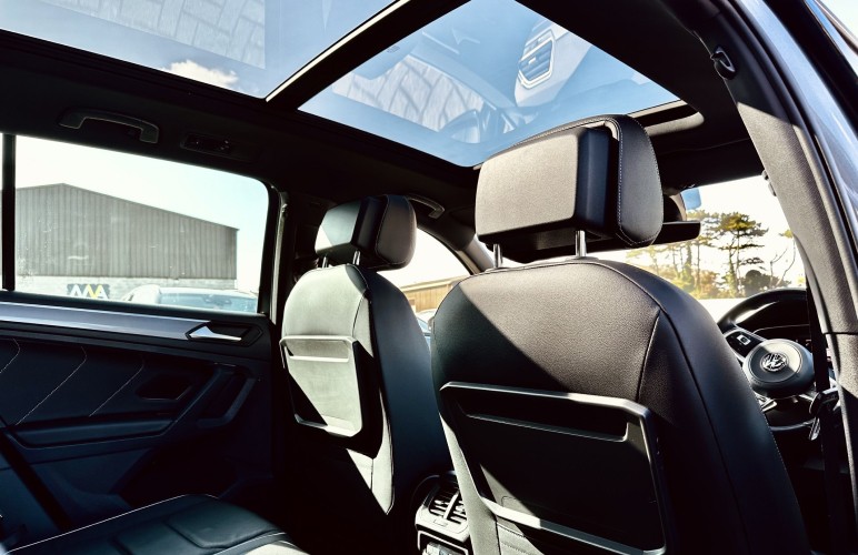 a close up of a steering wheel and dashboard of a car