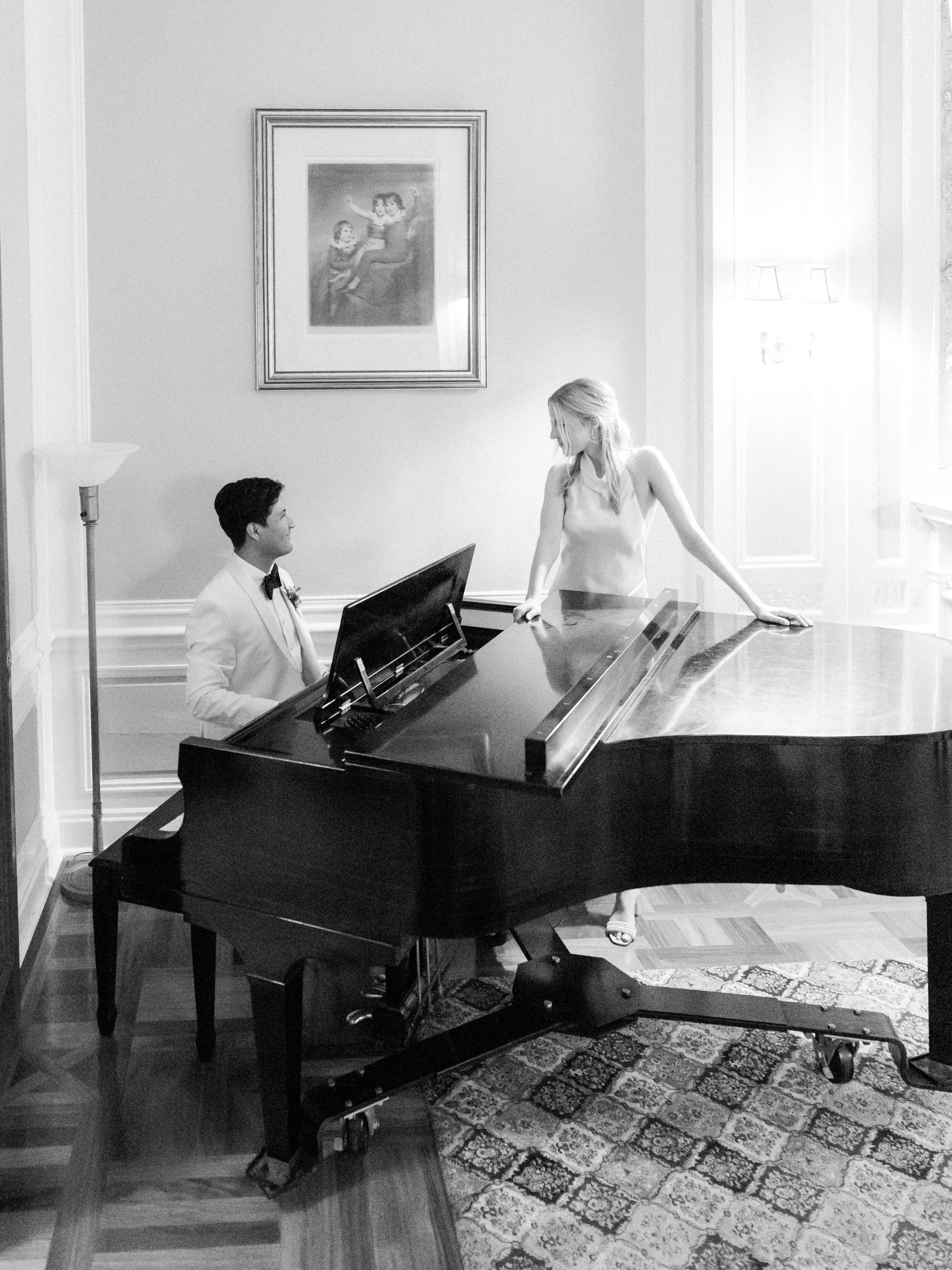 Person sitting on a ledge overlooking New York City skyline