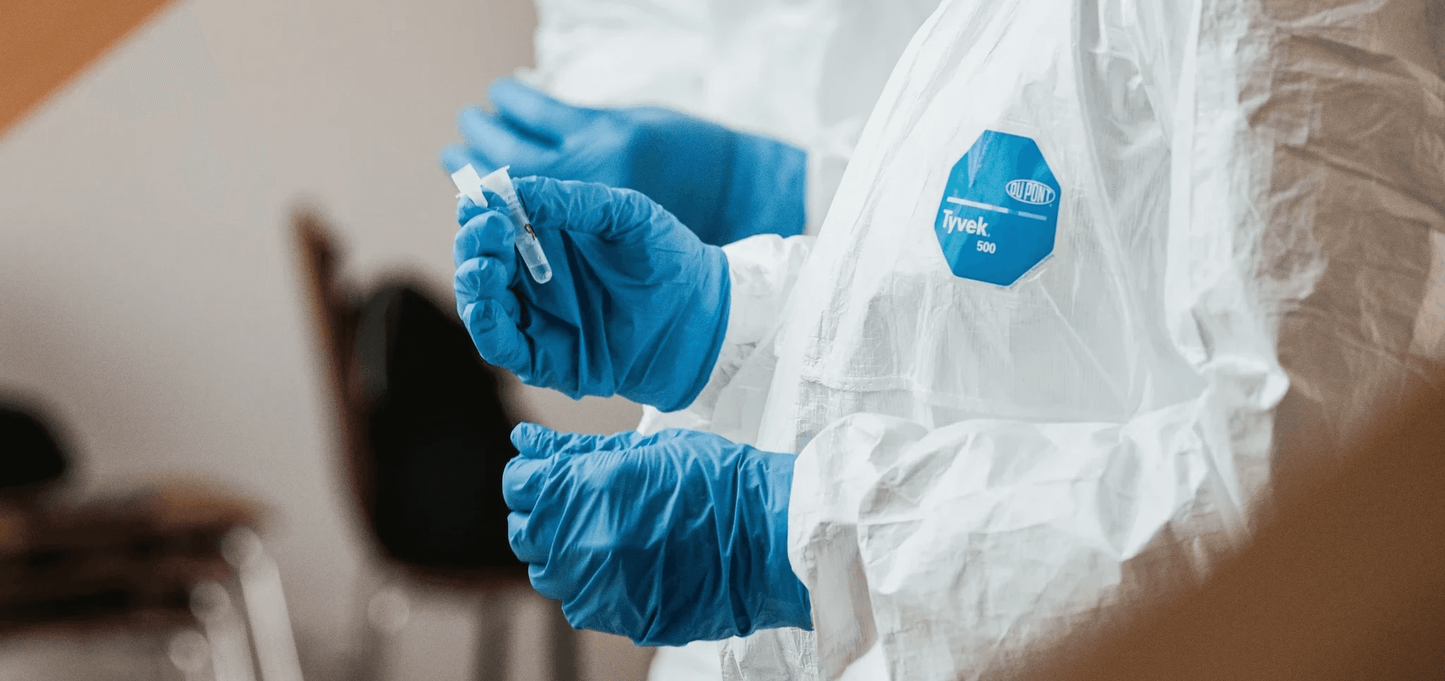 Researcher preparing samples for controlled mold testing in a laboratory setting