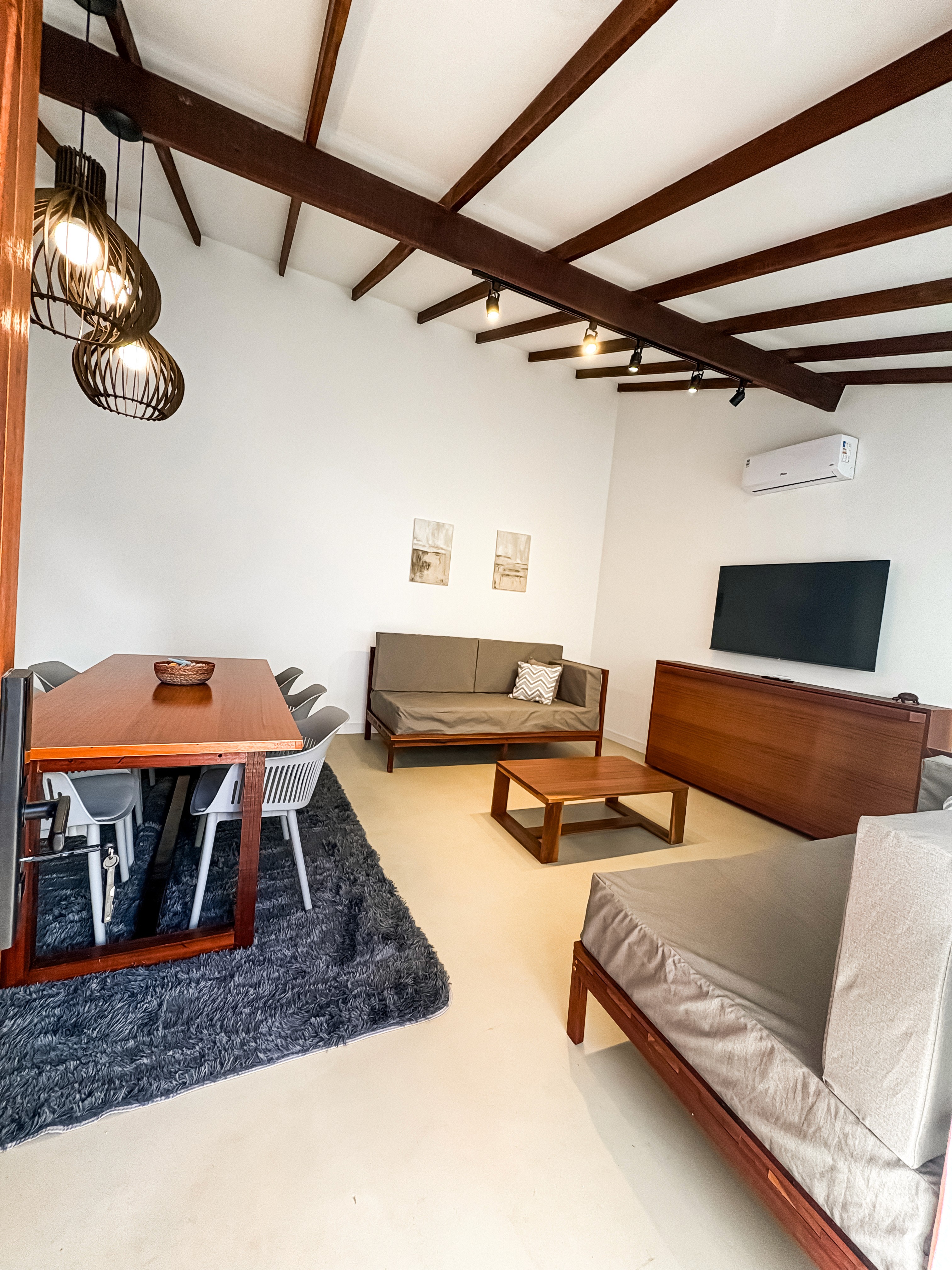 Straight-on view of panoramic windows, with a sleek writing desk positioned in front.