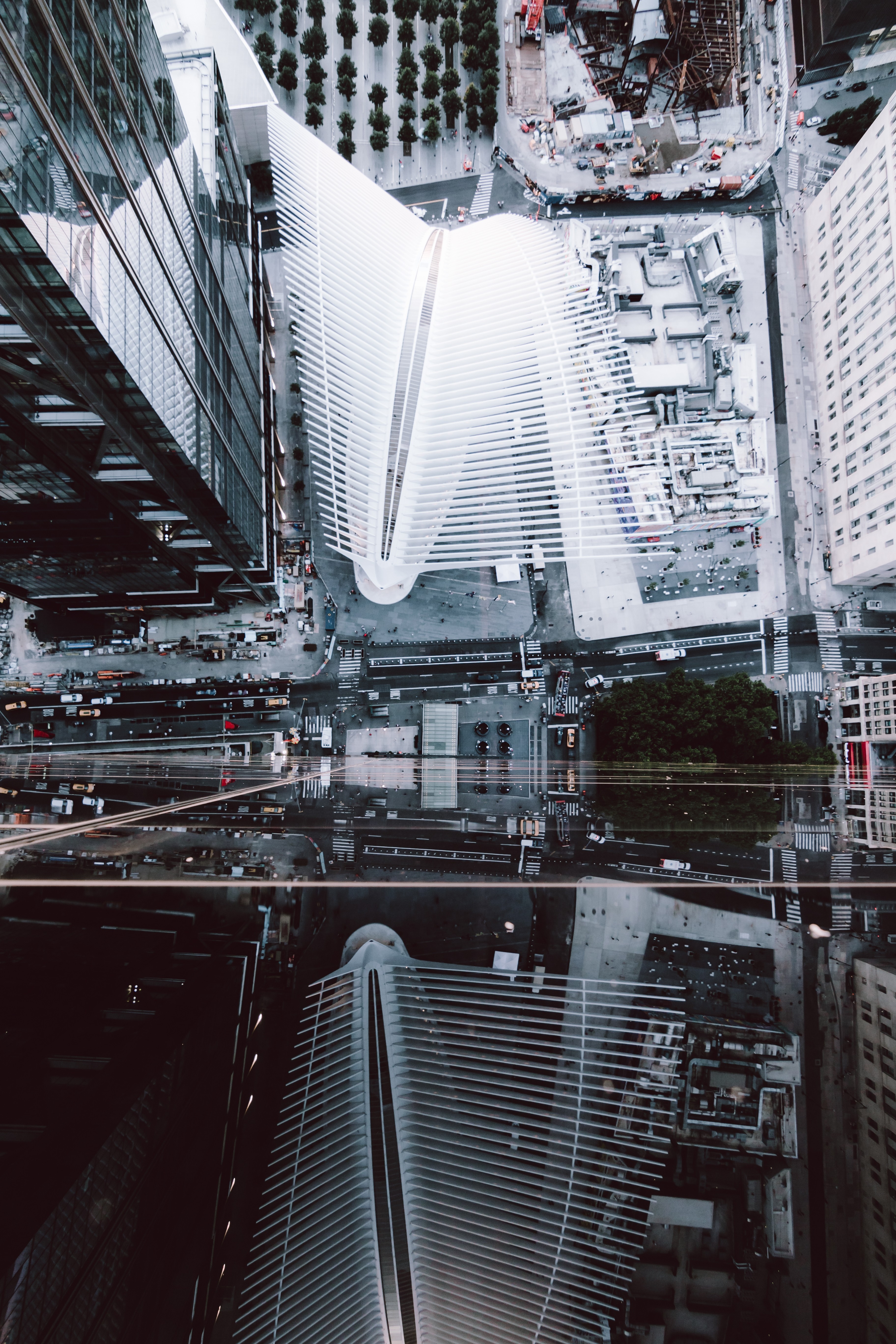 Three people in conversation with warm lighting, including a person wearing a hat and another person wrapped in what appears to be a textured shawl or sweater.
