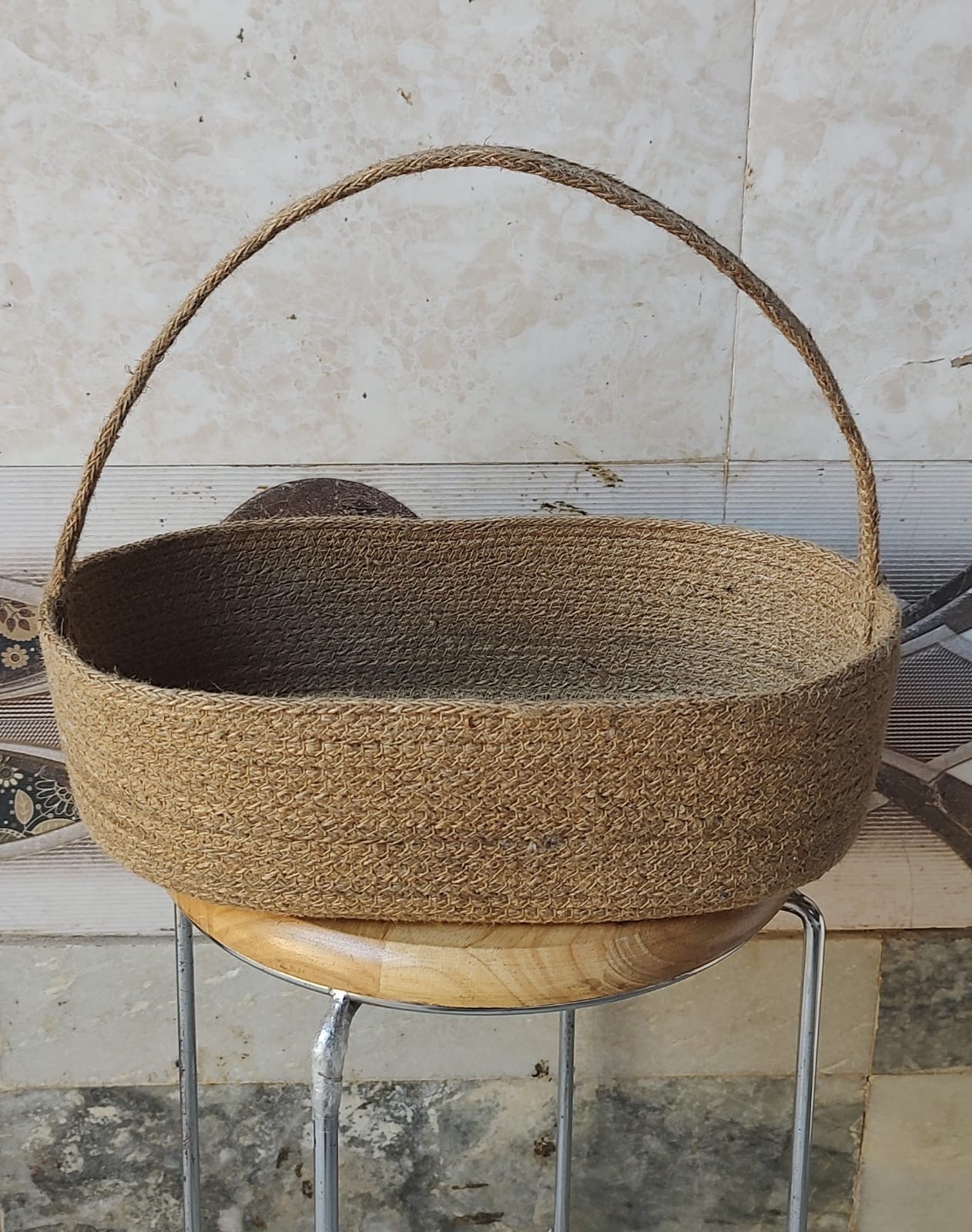 Handwoven oval jute storage basket with handle