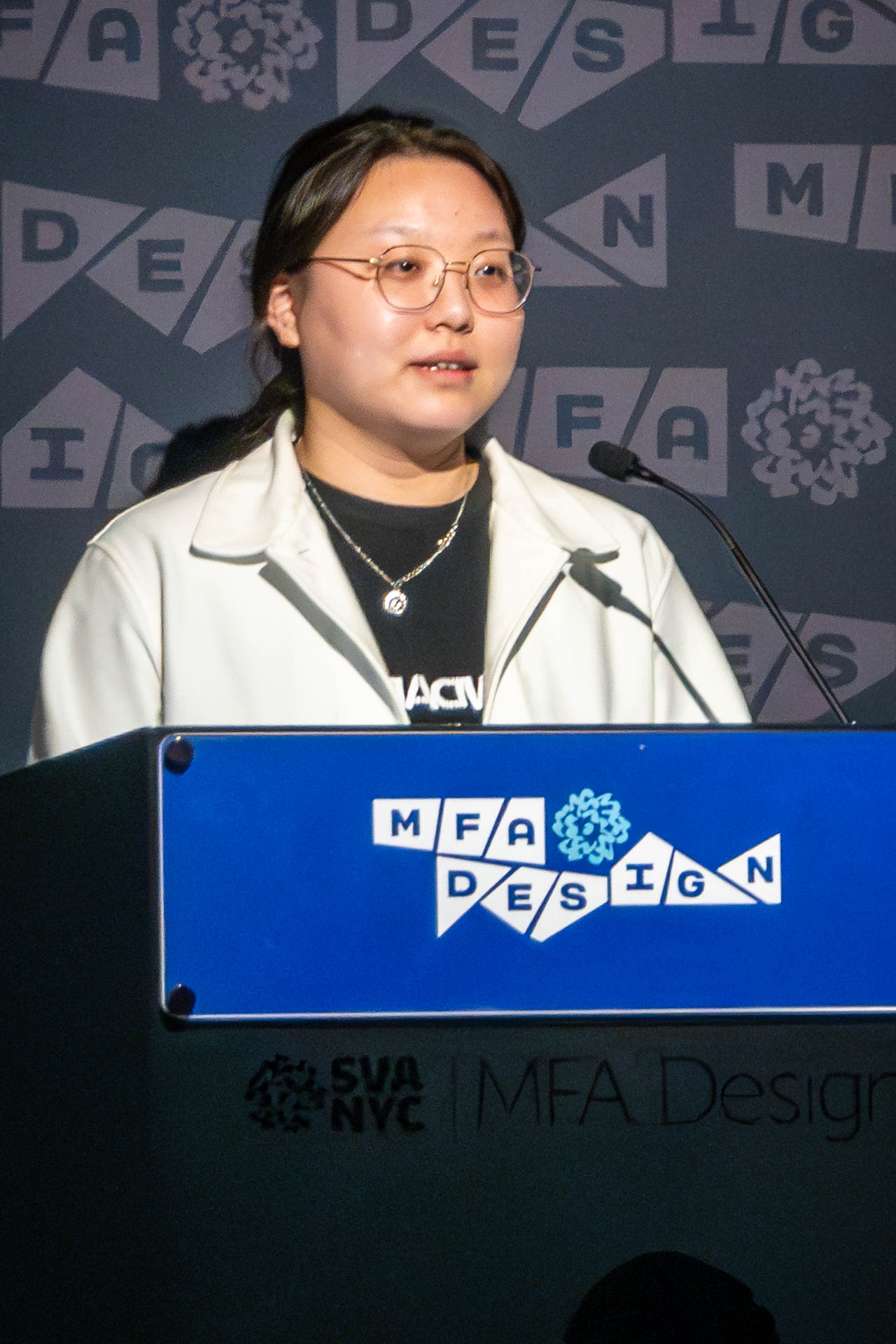 student at a podium giving a presentation