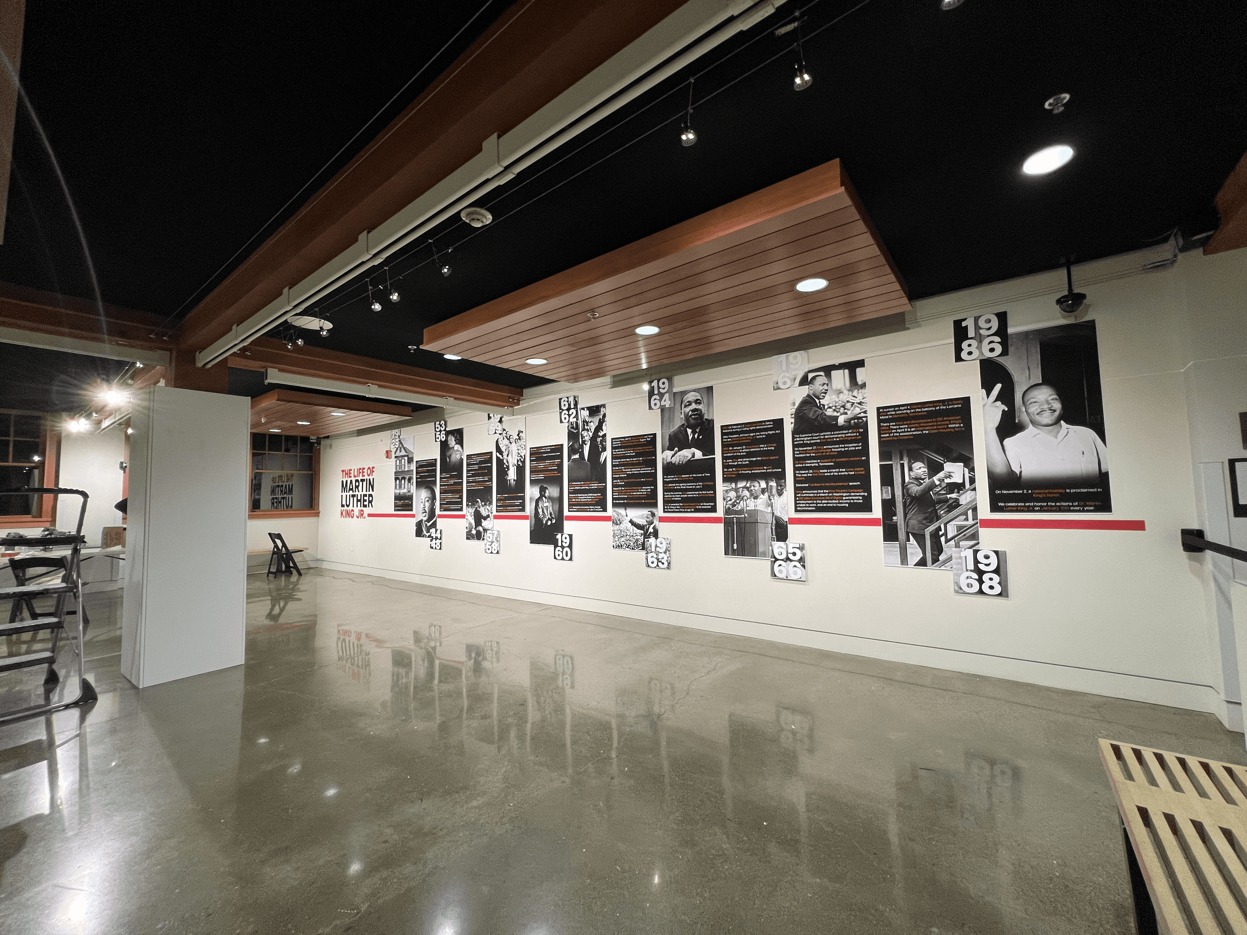 Deadpan wordmark on black: bold white “Deadpan” in italic sans-serif, preceded by a distressed white smiley face logo (crossed-out eyes, tongue sticking out) on a solid black field.