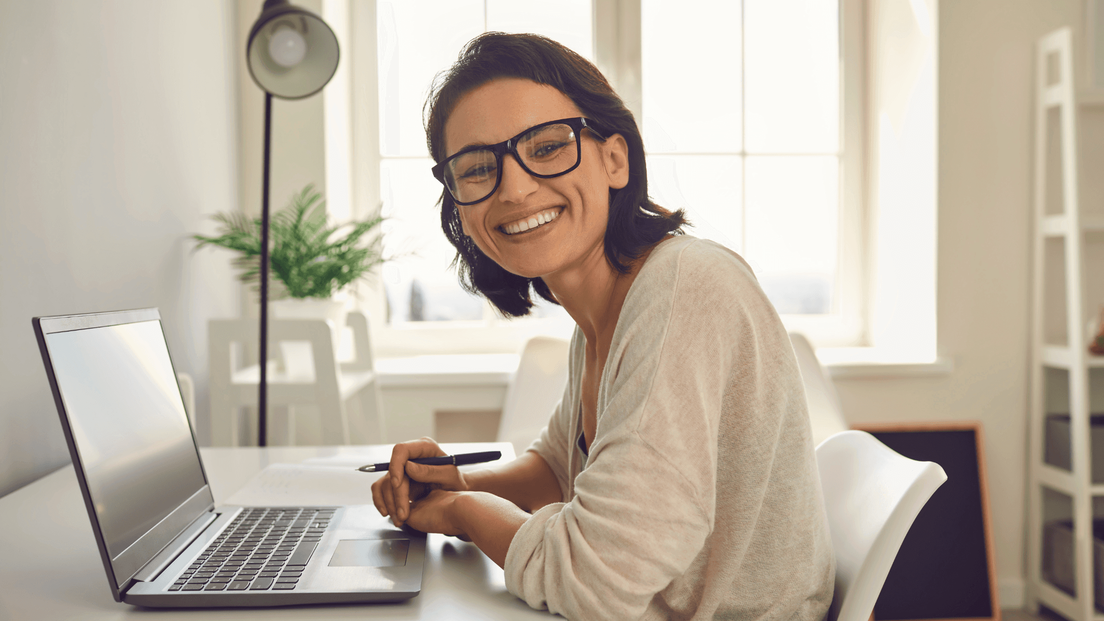 Person working on a laptop using Tiebreaker AI’s IntelVerse platform to manage ISO27001 compliance through AI-powered tools