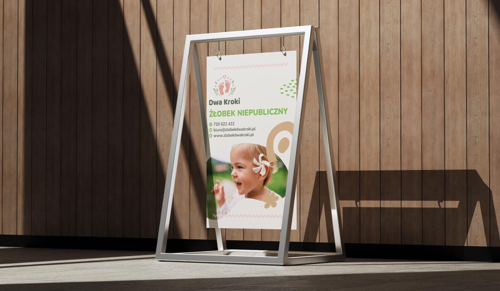 Potykacz z grafiką promocyjną dwa kroki