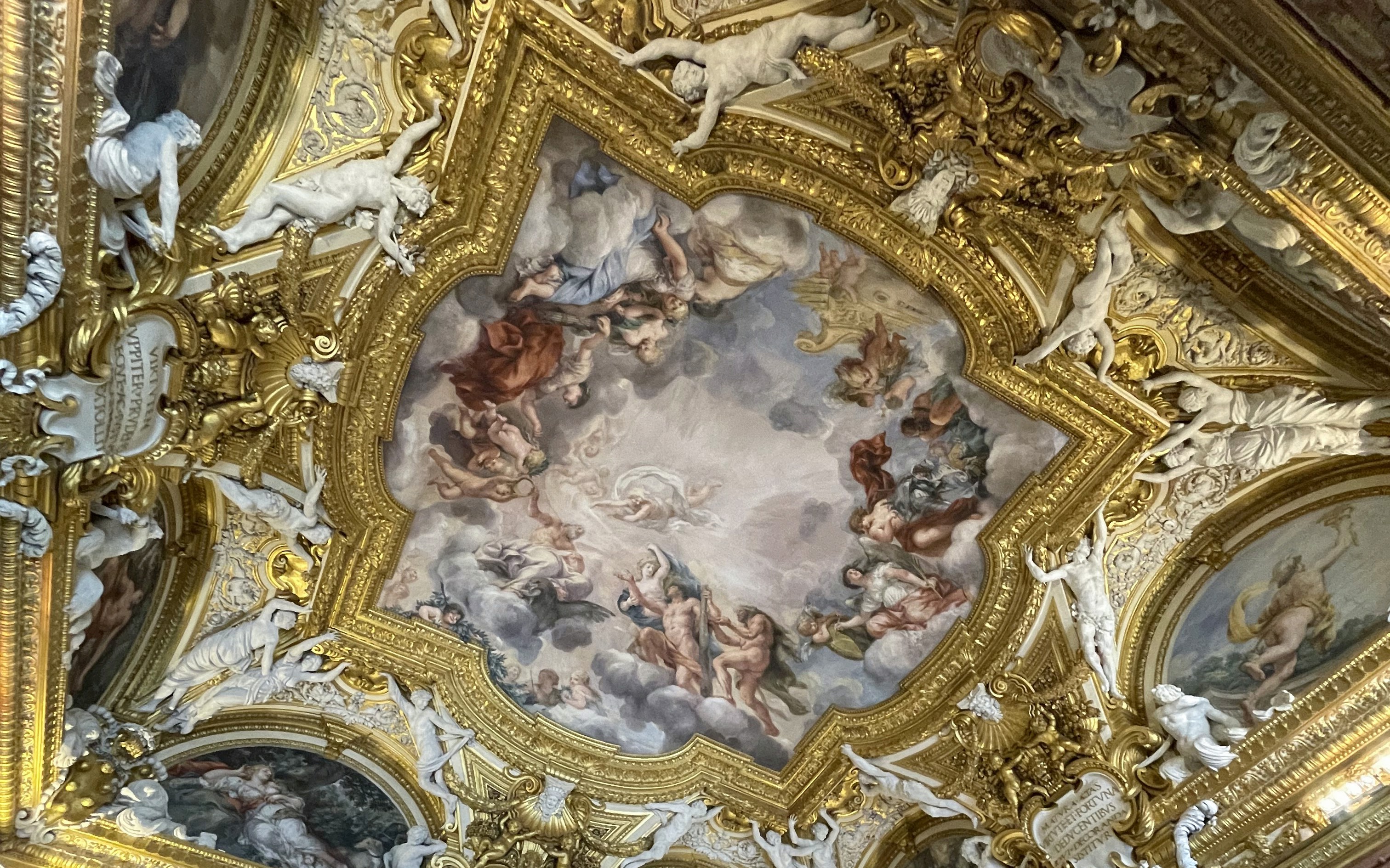 Pitti Palace ceiling frescoes depicting mythological figures in Florence, Italy.