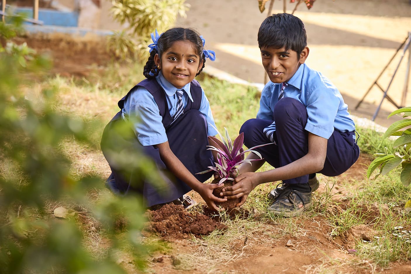 Kids planting tree for a Eco friendly Living