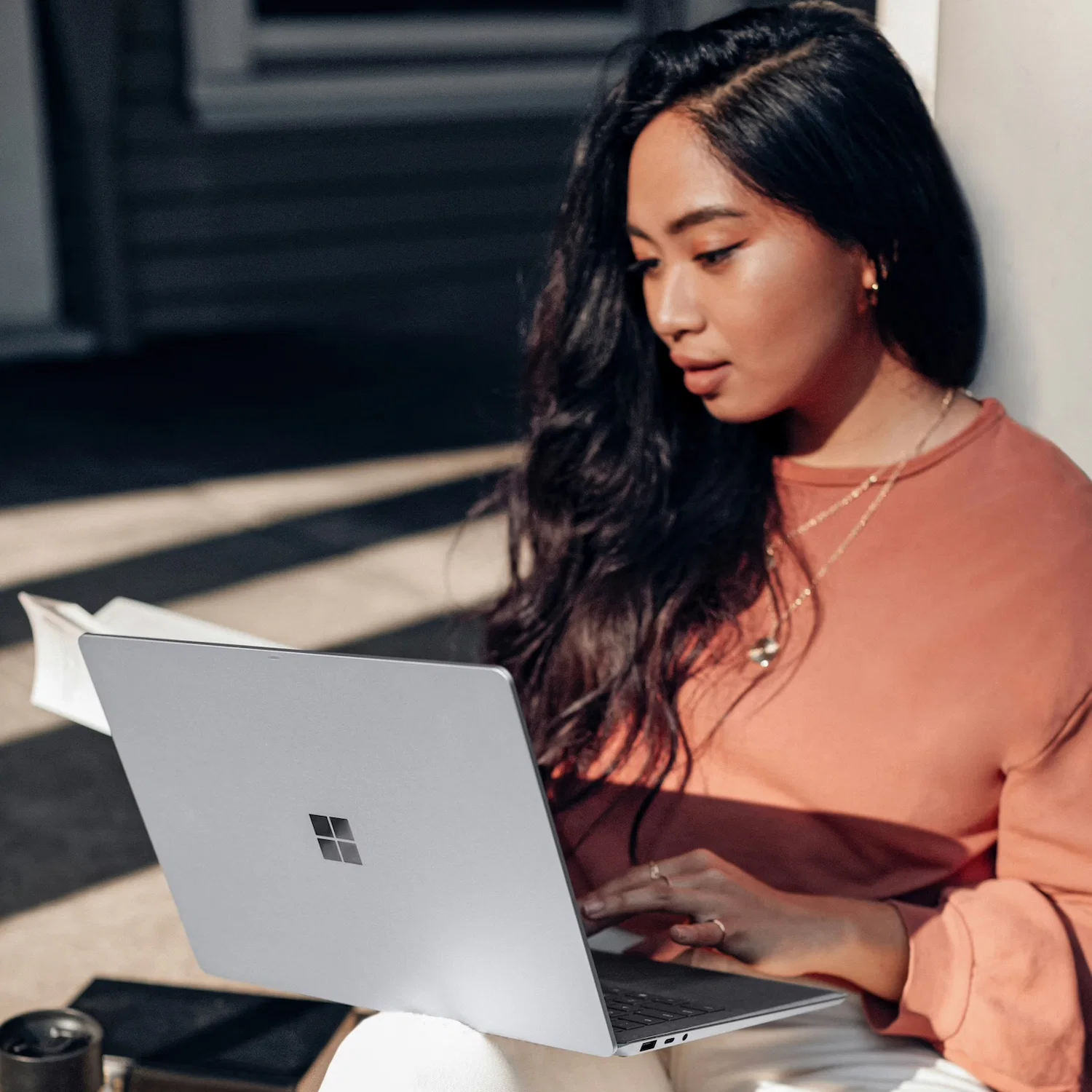 Woman attending an online therapy session from Los Angeles on her laptop, focusing on mental wellness and personal growth.