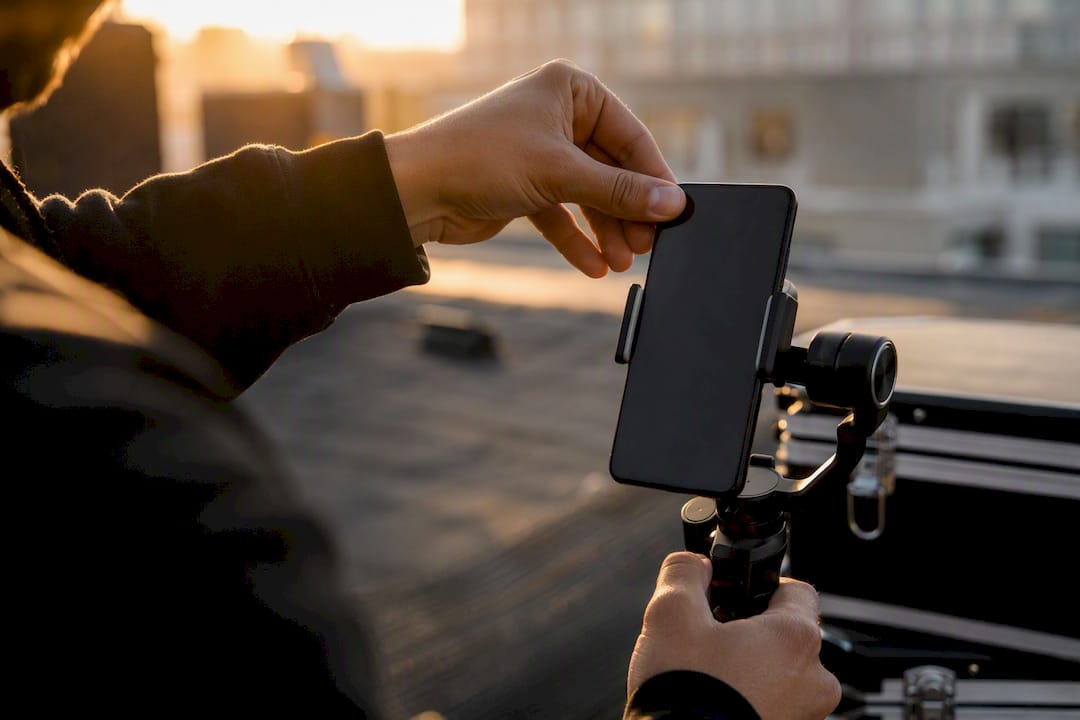 Hands setting up smartphone for vertical video ad
