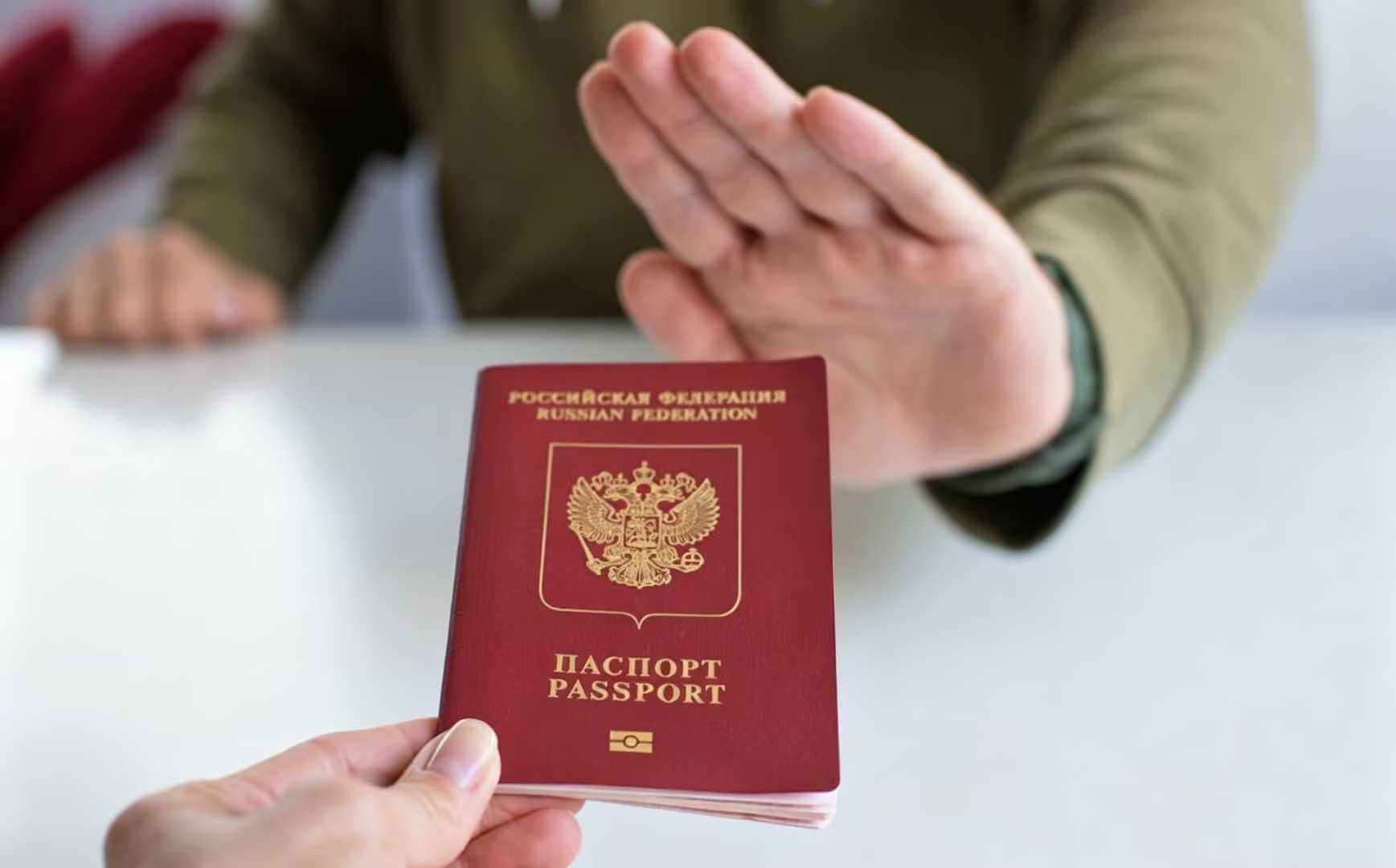 Passport being rejected at an immigration desk