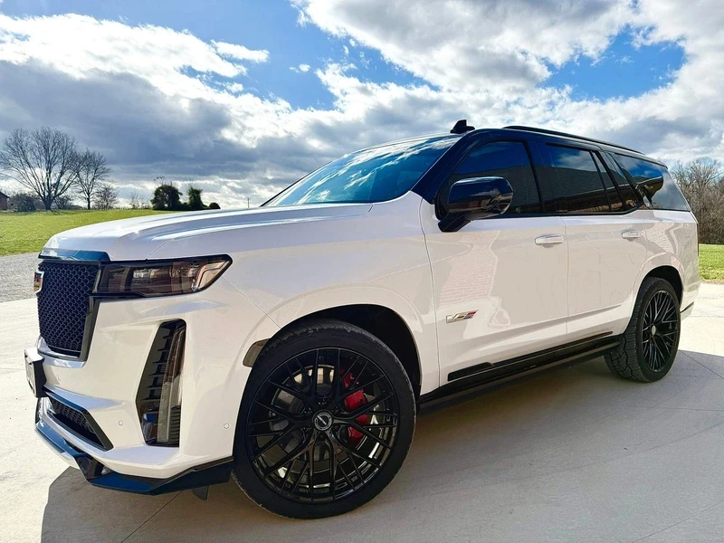 Large white vehicle outdoors on a sunny day