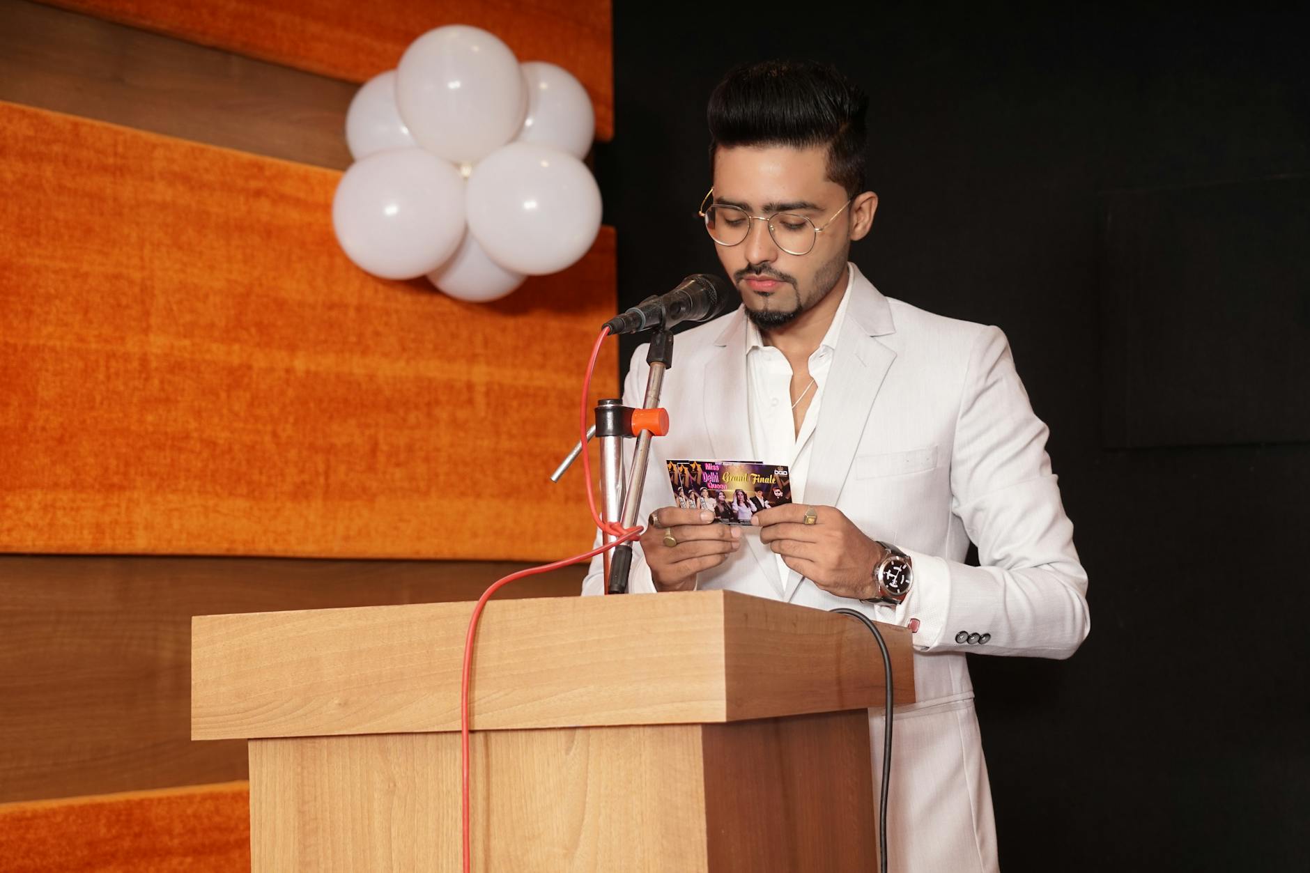 A woman speaking passionately at a podium during a legislative hearing regarding national education policy reform.
