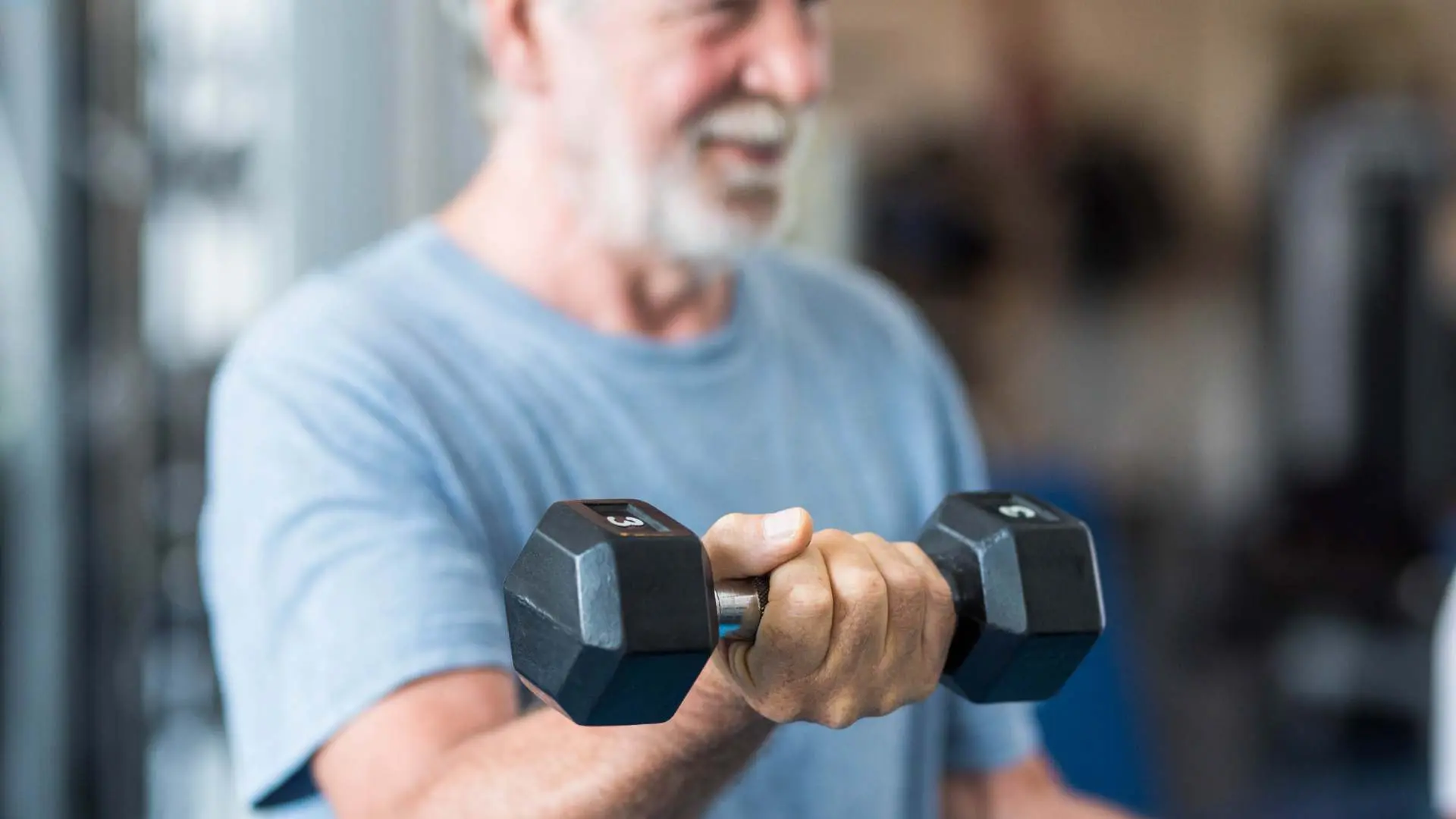 man holding a dumbell
