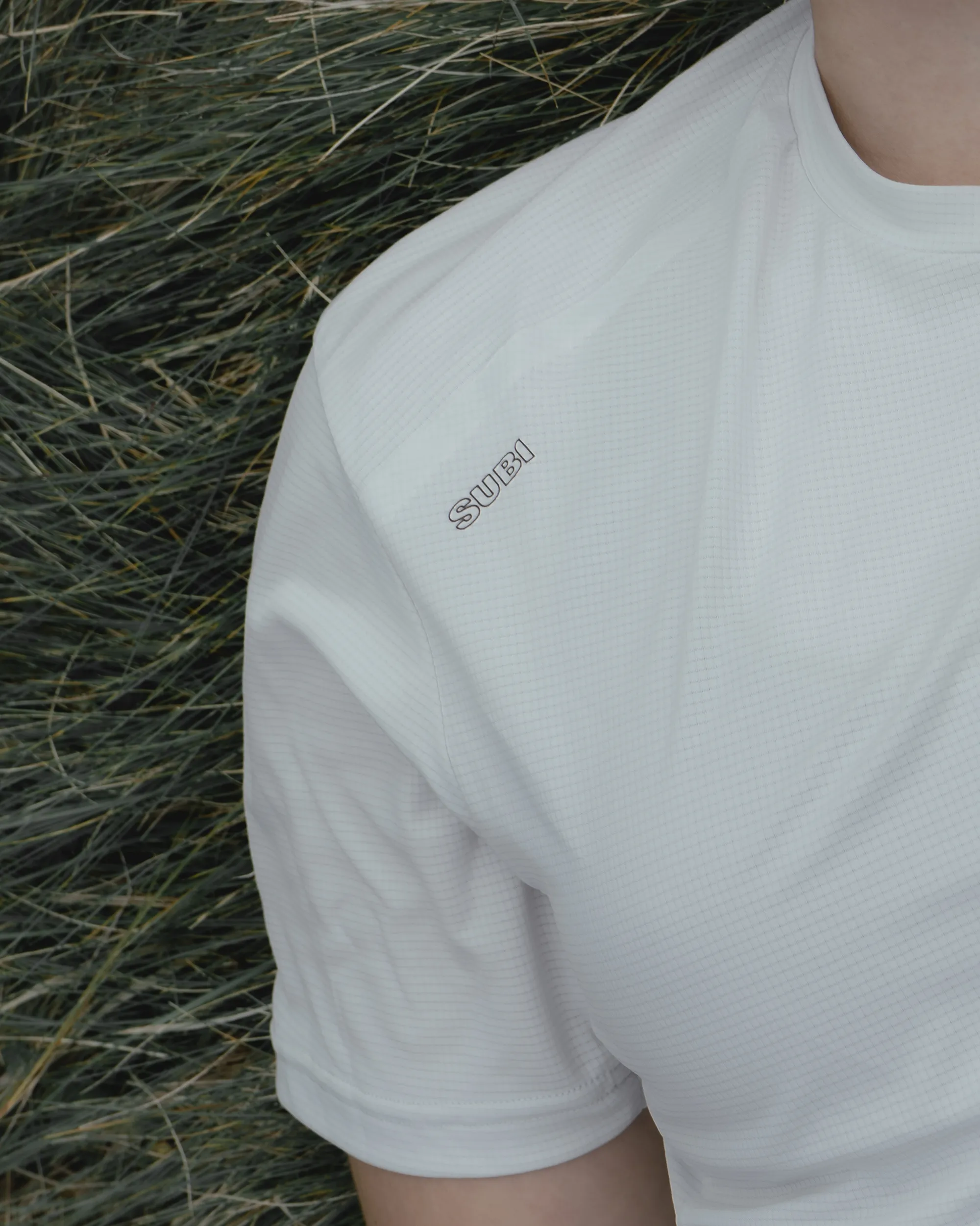 a close-up picture of a Subi Running logo tshirt.