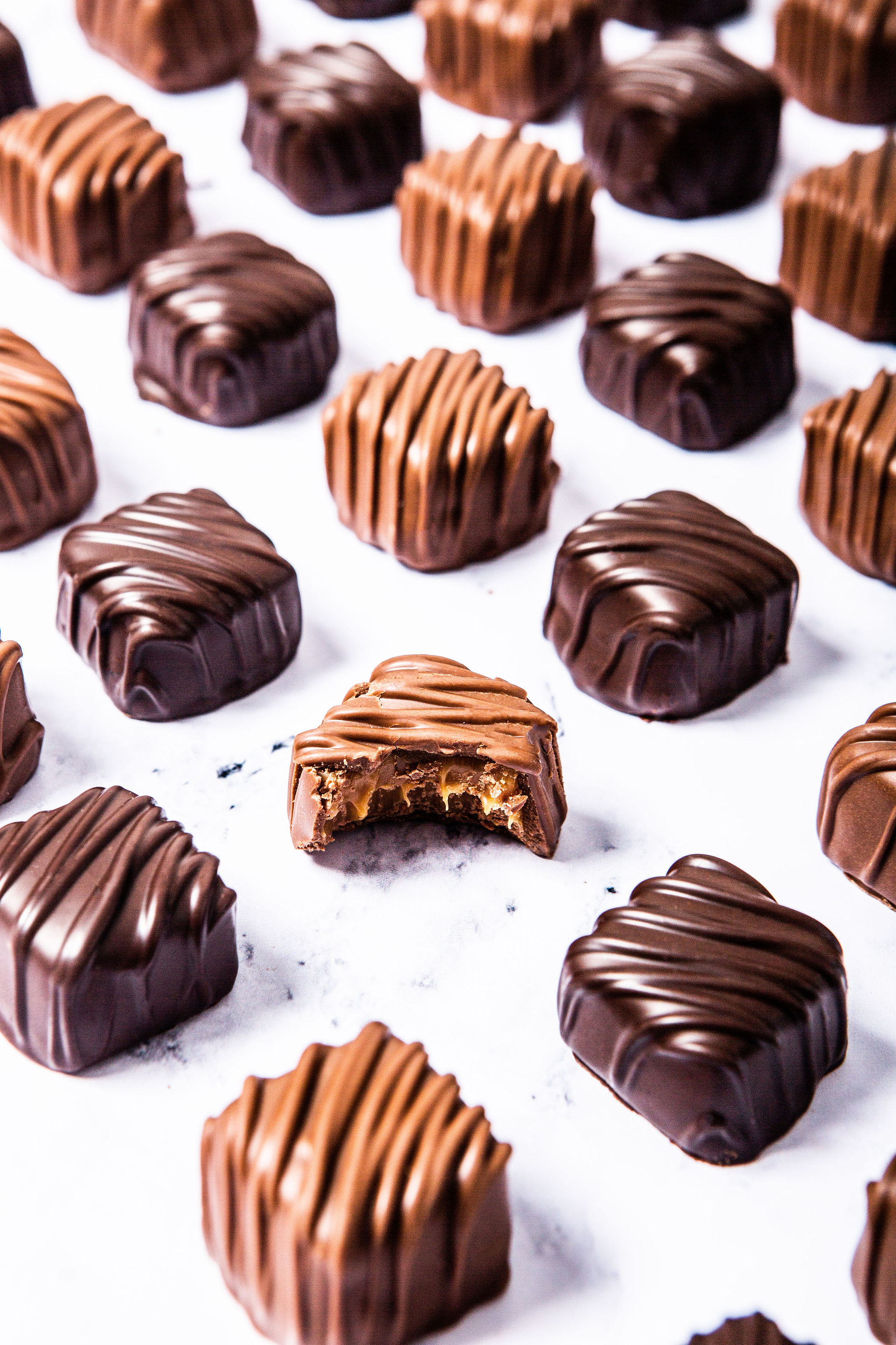 Woman with red hair covering mouth with hair