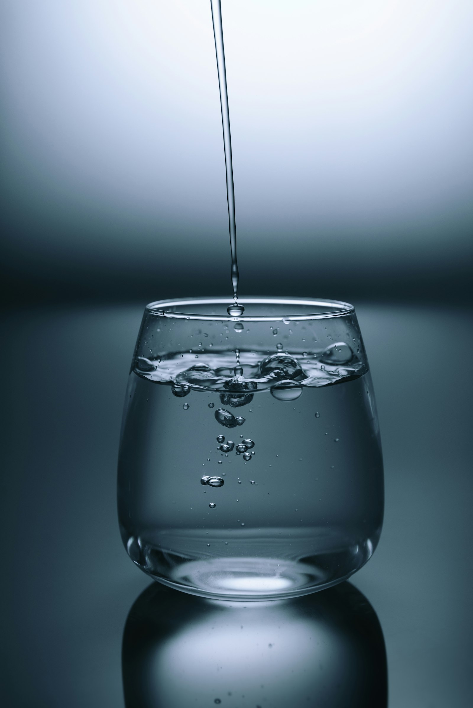 Glass of clean filtered water on a clean countertop