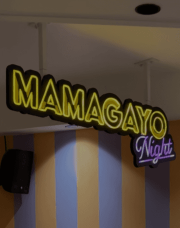 A smiley boy holds a table