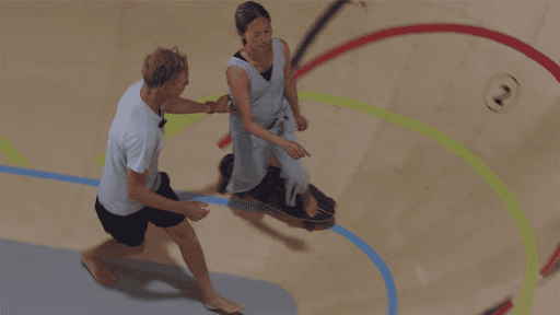 A person being guided while riding a skateboard in SurfLab HQ's skate bowlguided 