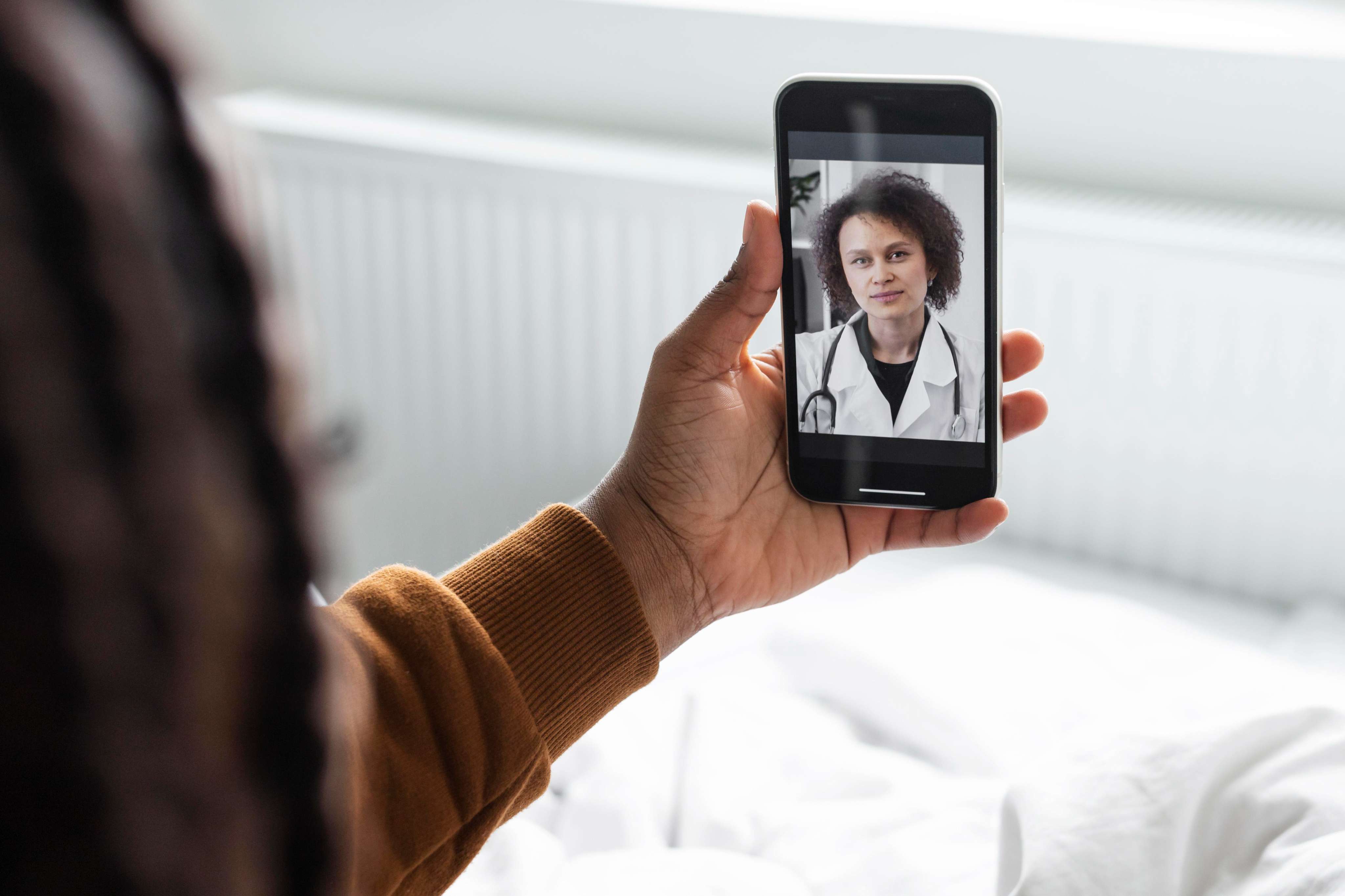sick-man-having-video-call-with-doctor
